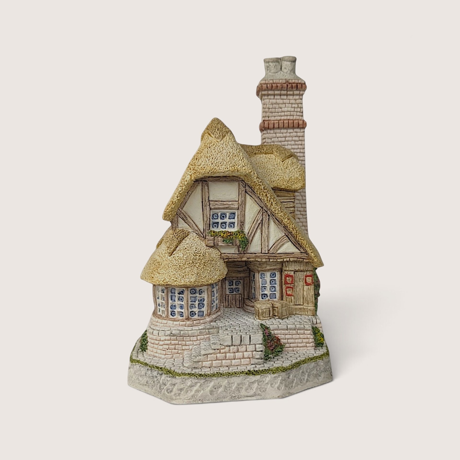Signed 1991 David Winter miniature cottage sculpture of Audrey's Tea Room with thatched roof.
