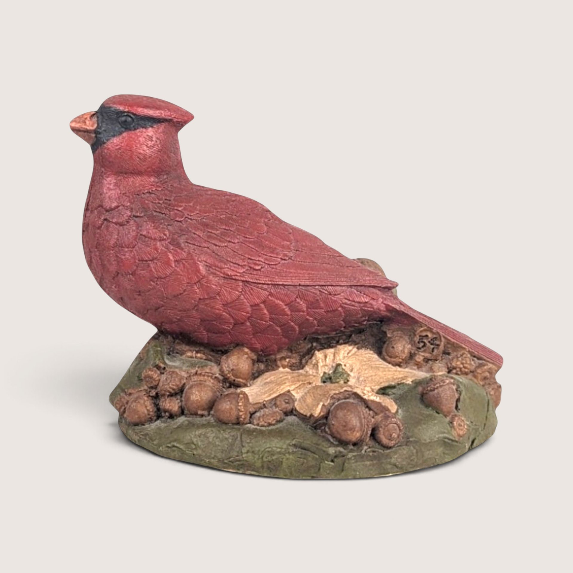 Vintage hand-cast resin Tom Clark Cairn Studio cardinal figurine on a forest floor base with intricate textured details.