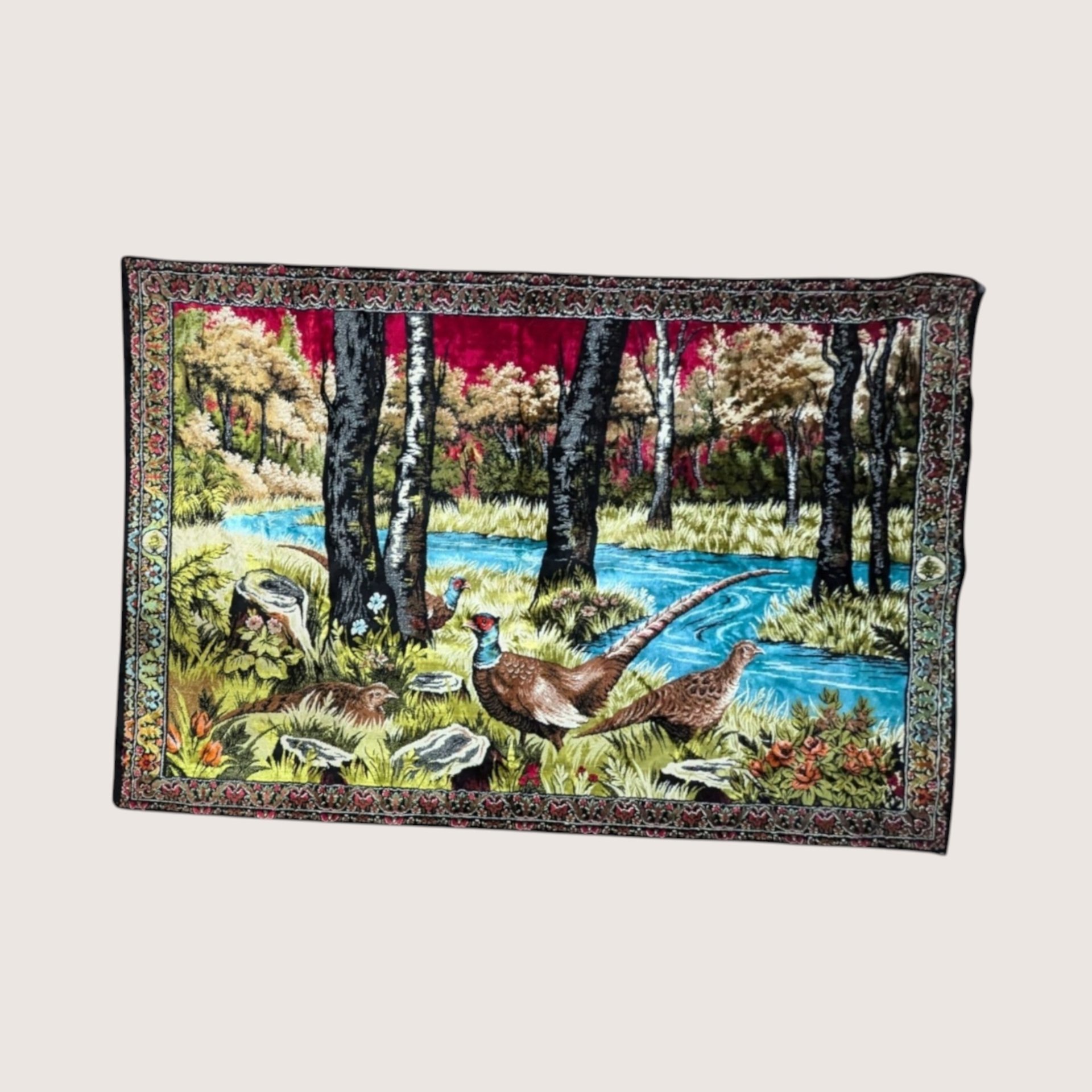 Large vintage textile wall tapestry depicting pheasants by a blue river in a forest with an ornate border.