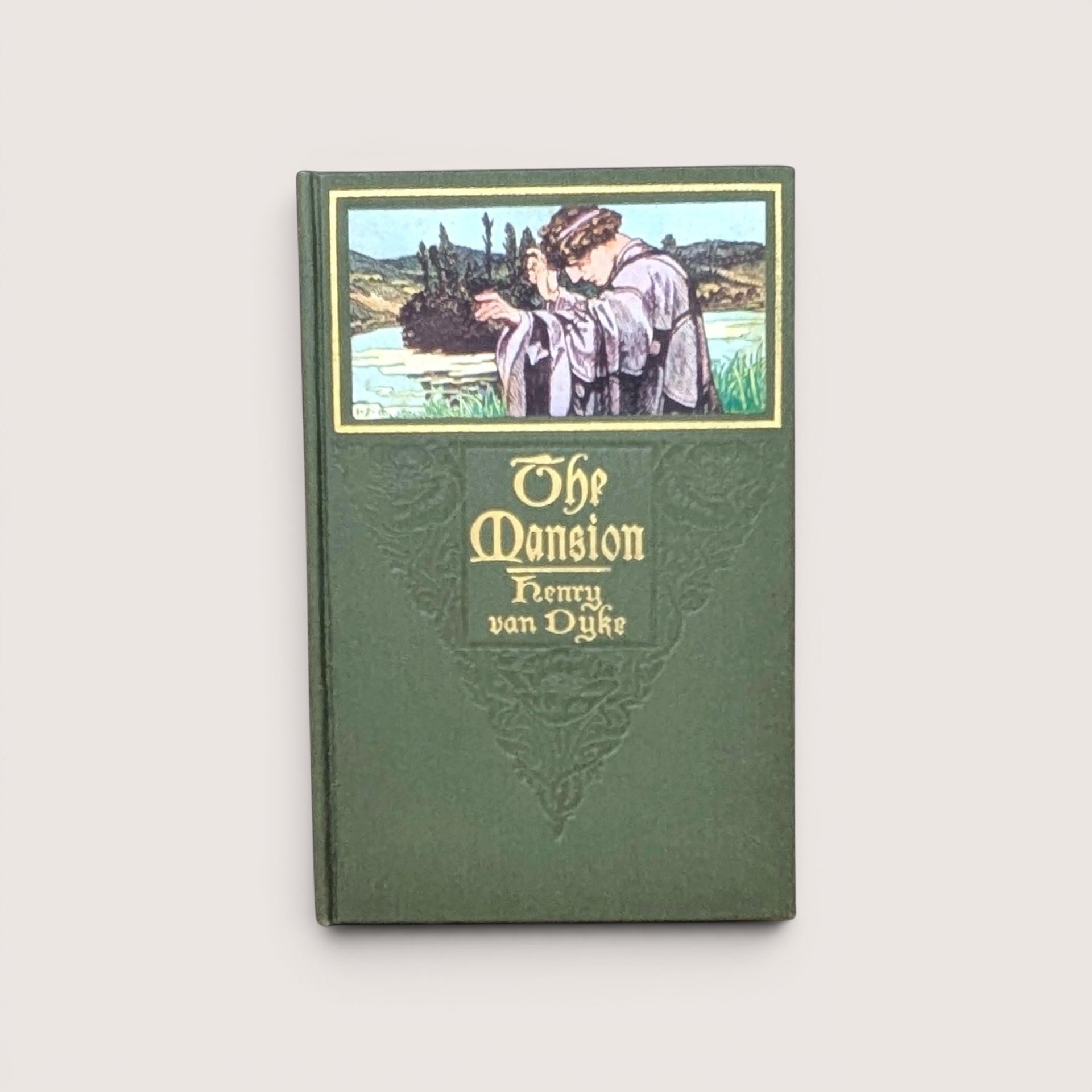 A green cloth-bound hardcover book featuring a color illustration of a man in robes looking over a landscape, with gilded title text for The Mansion by Henry Van Dyke against a neutral background.
