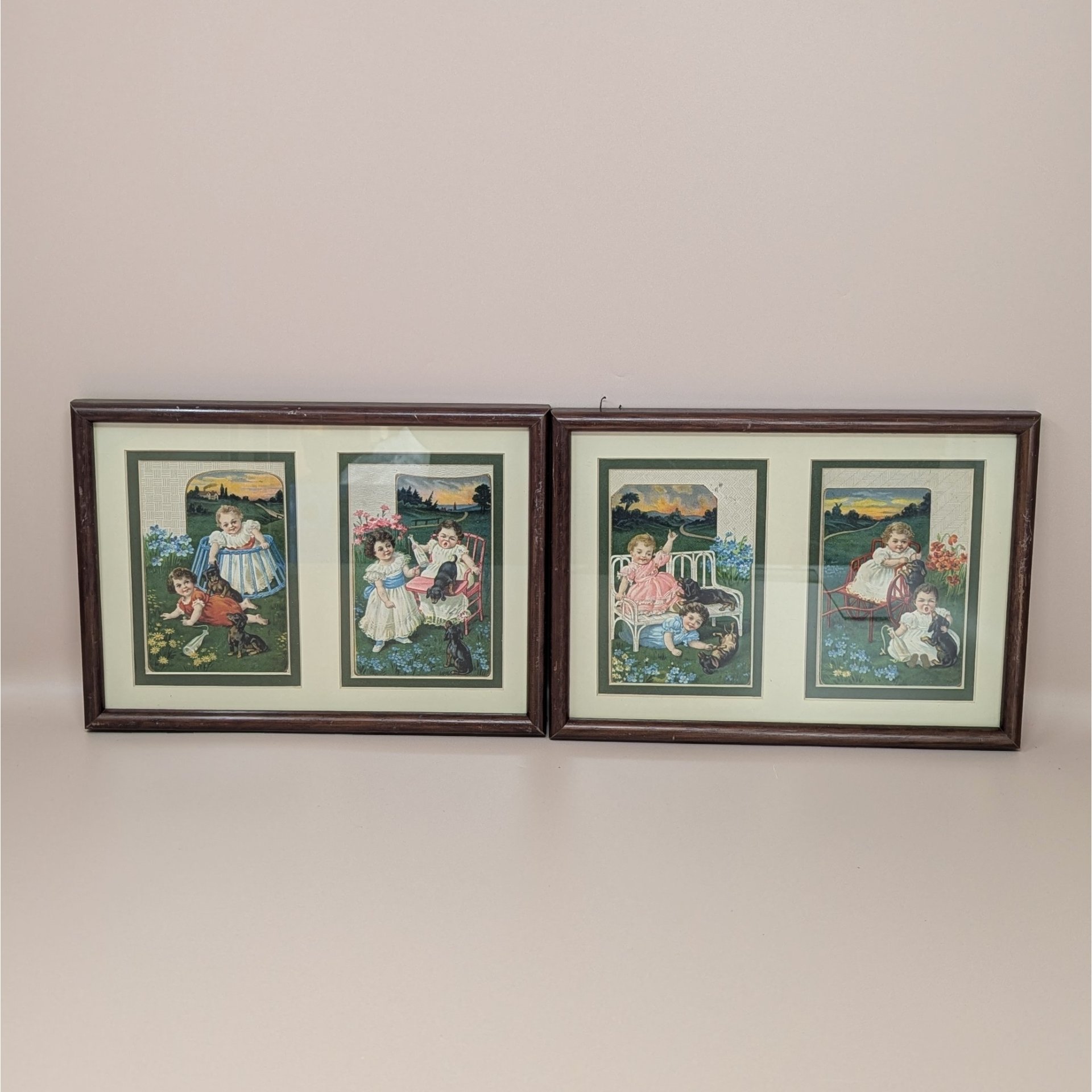 A set of two framed wall hangings, each containing two vintage-style advertising cards featuring Victorian children and puppies in pastoral outdoor settings.