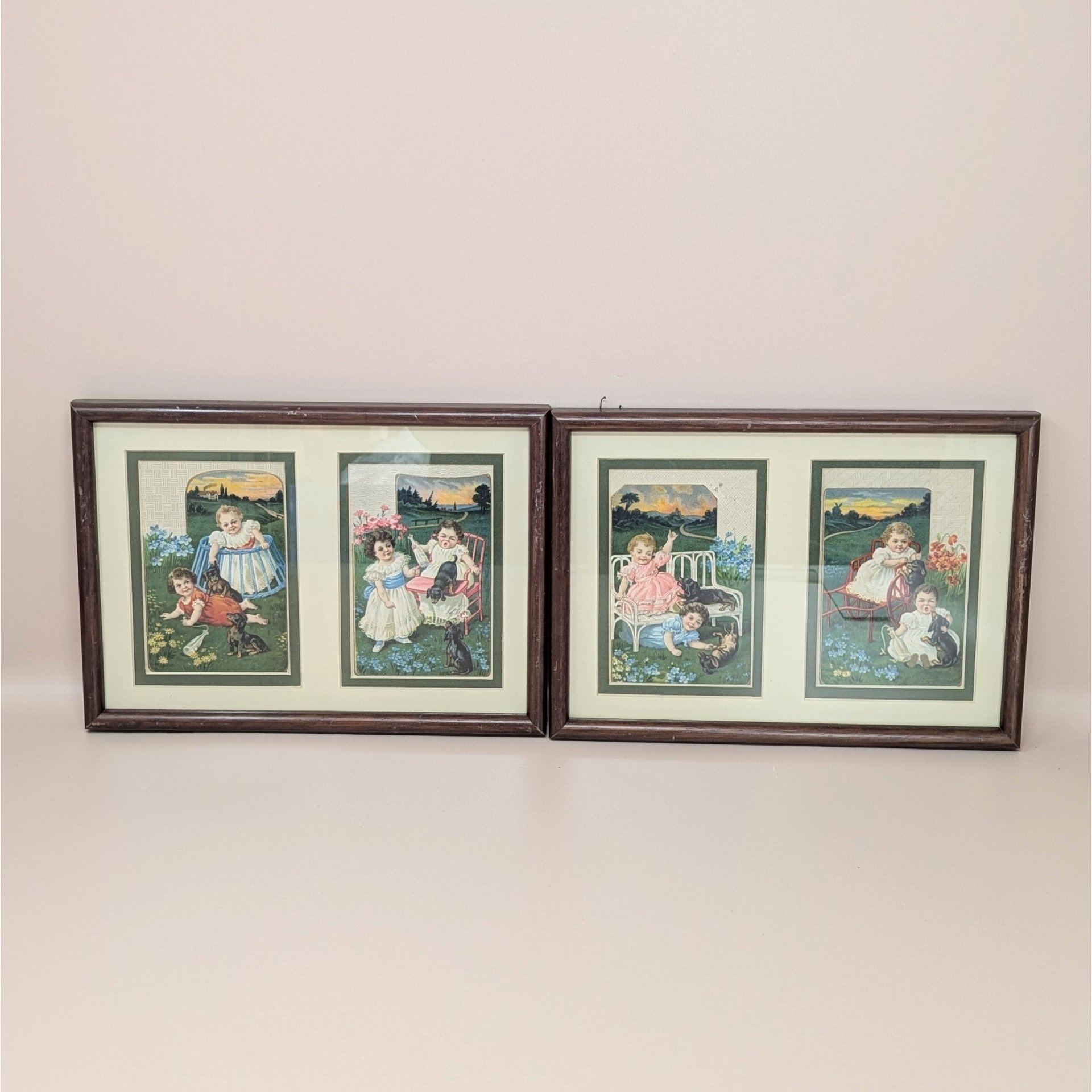 A set of two framed wall hangings, each containing two vintage-style advertising cards featuring Victorian children and puppies in pastoral outdoor settings.