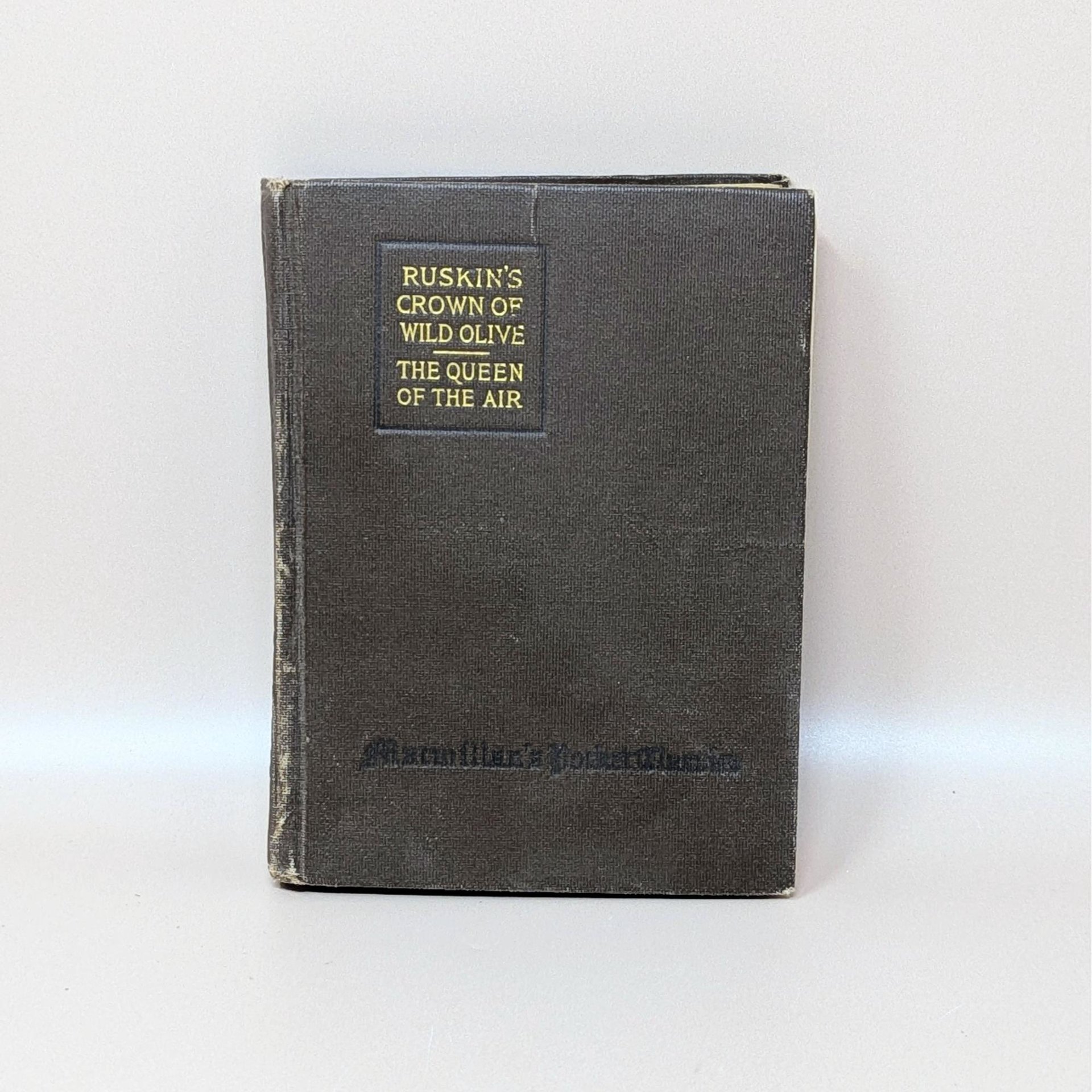 A 1918 Macmillan Pocket Classic edition of Ruskin's Crown of Wild Olive and The Queen of the Air with a dark brown textured cover and gold gilt lettering