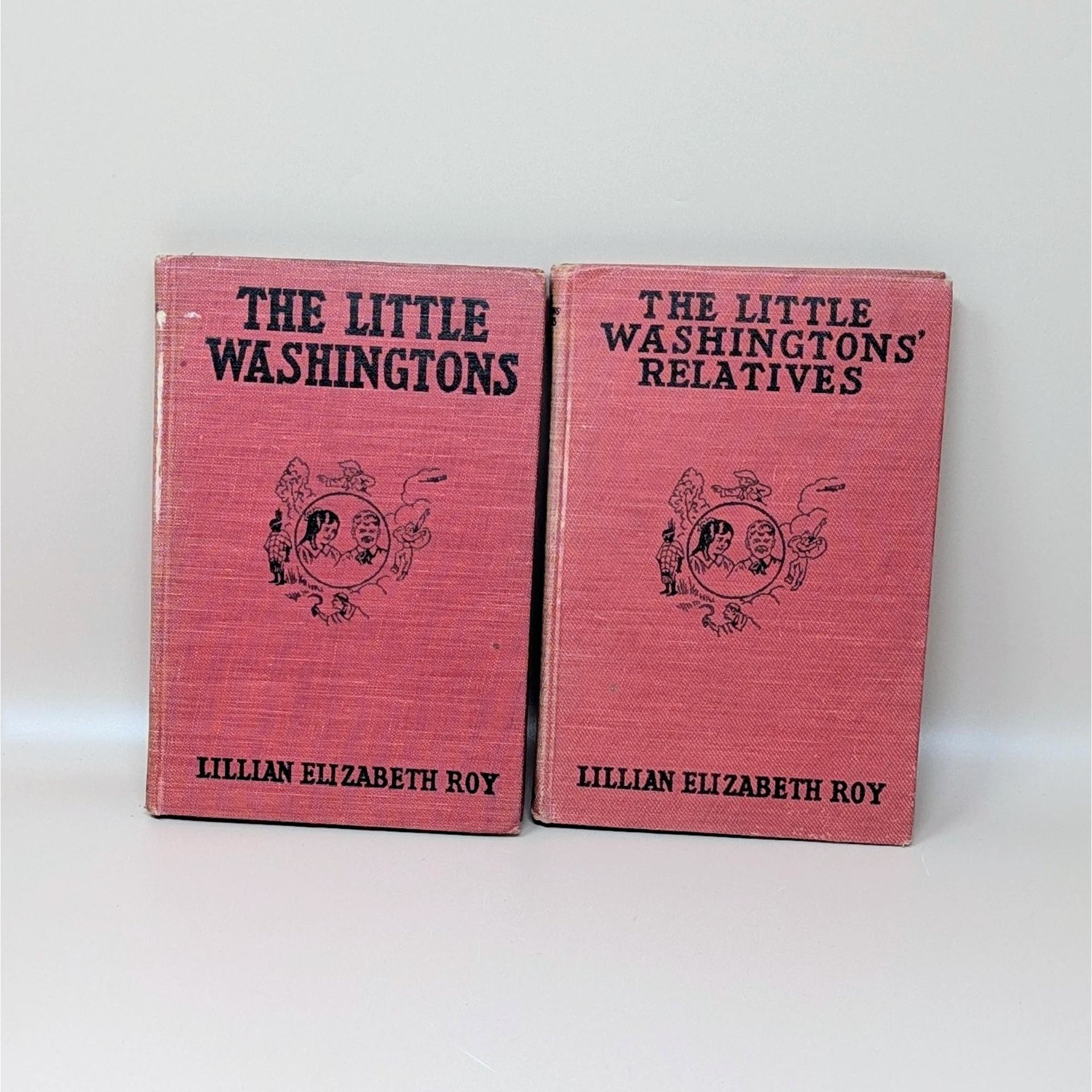 Two vintage 1918 hardcover books titled The Little Washingtons and The Little Washingtons' Relatives with red textured covers and black illustrations of children