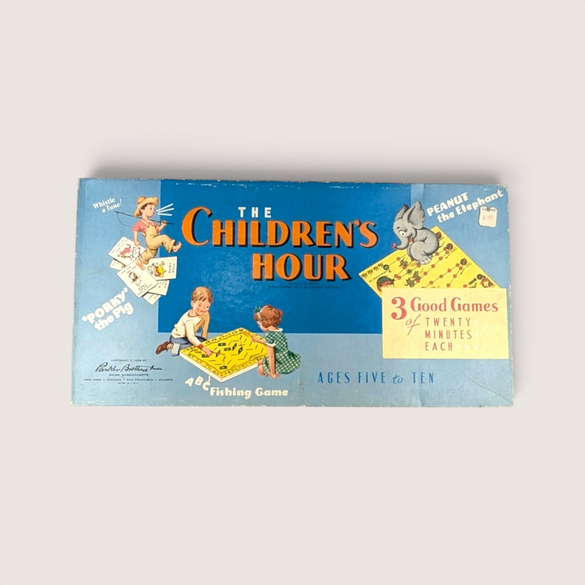 Vintage The Children's Hour board game box in light blue featuring mid-century illustrations of children playing.