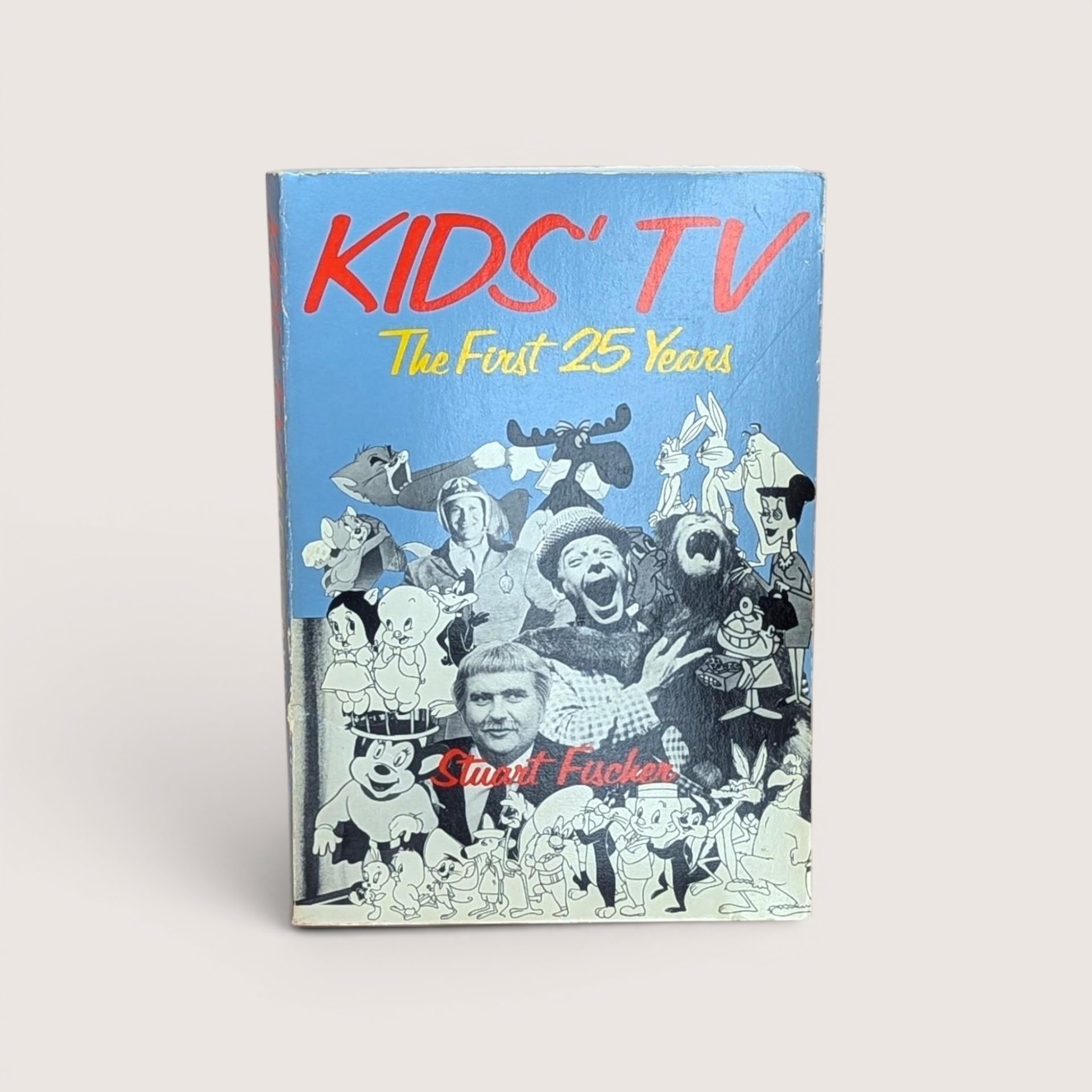 The cover of the book Kids TV The First 25 Years by Stuart Fischer featuring various classic cartoon characters.