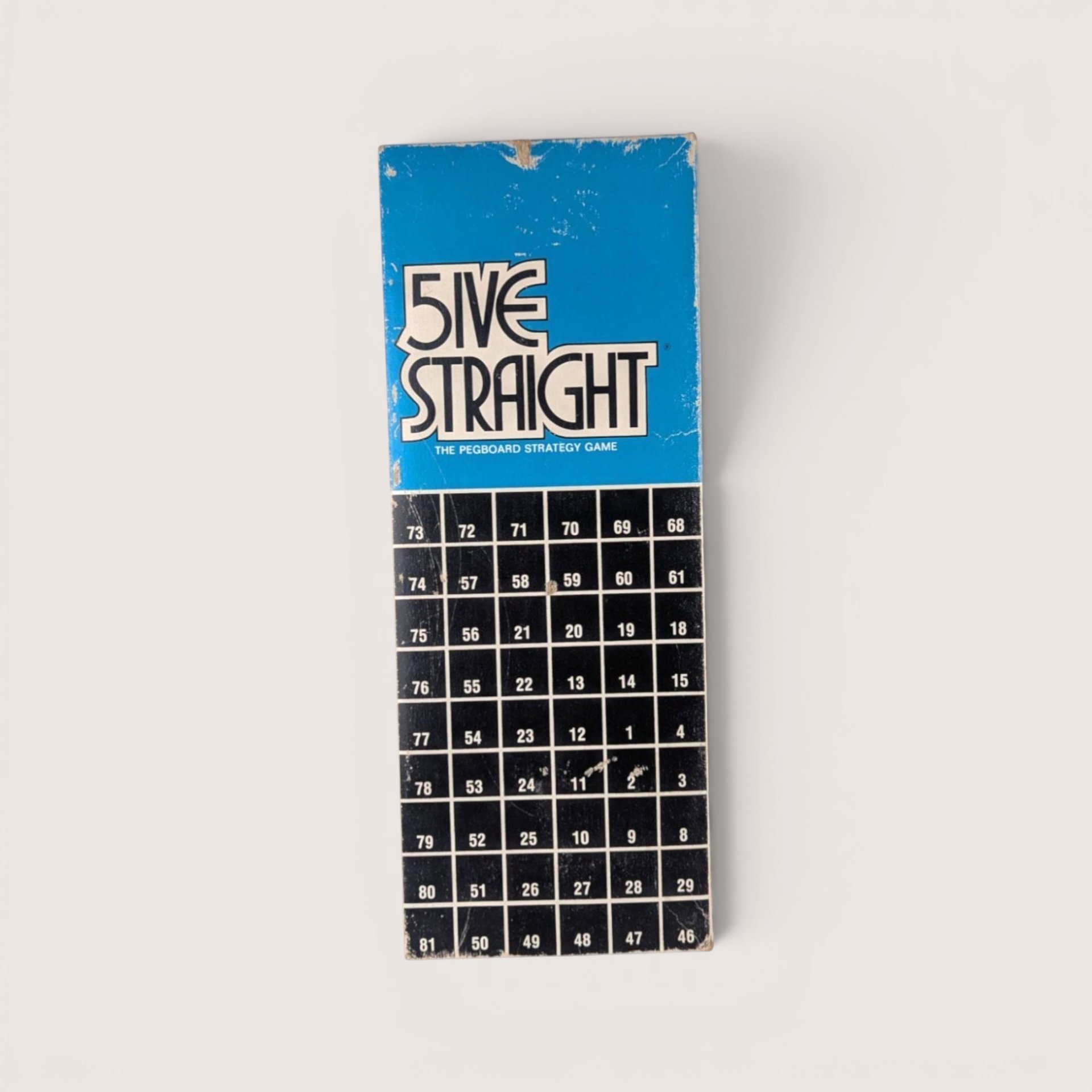 Vintage Five Straight pegboard game box featuring a blue and black design with numbered grid squares.