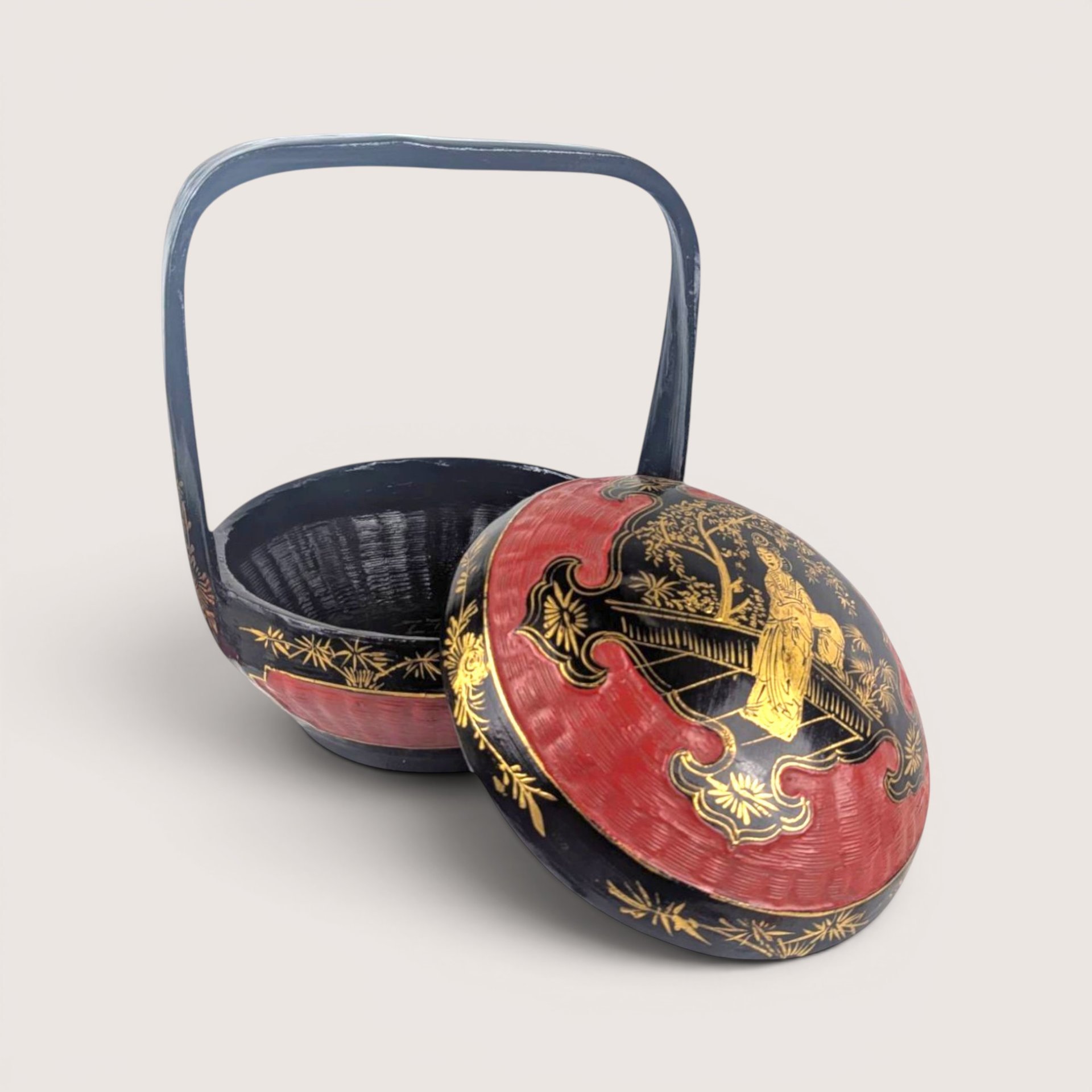A vintage Chinese hand painted bamboo wedding basket with a black and red lacquer finish.
