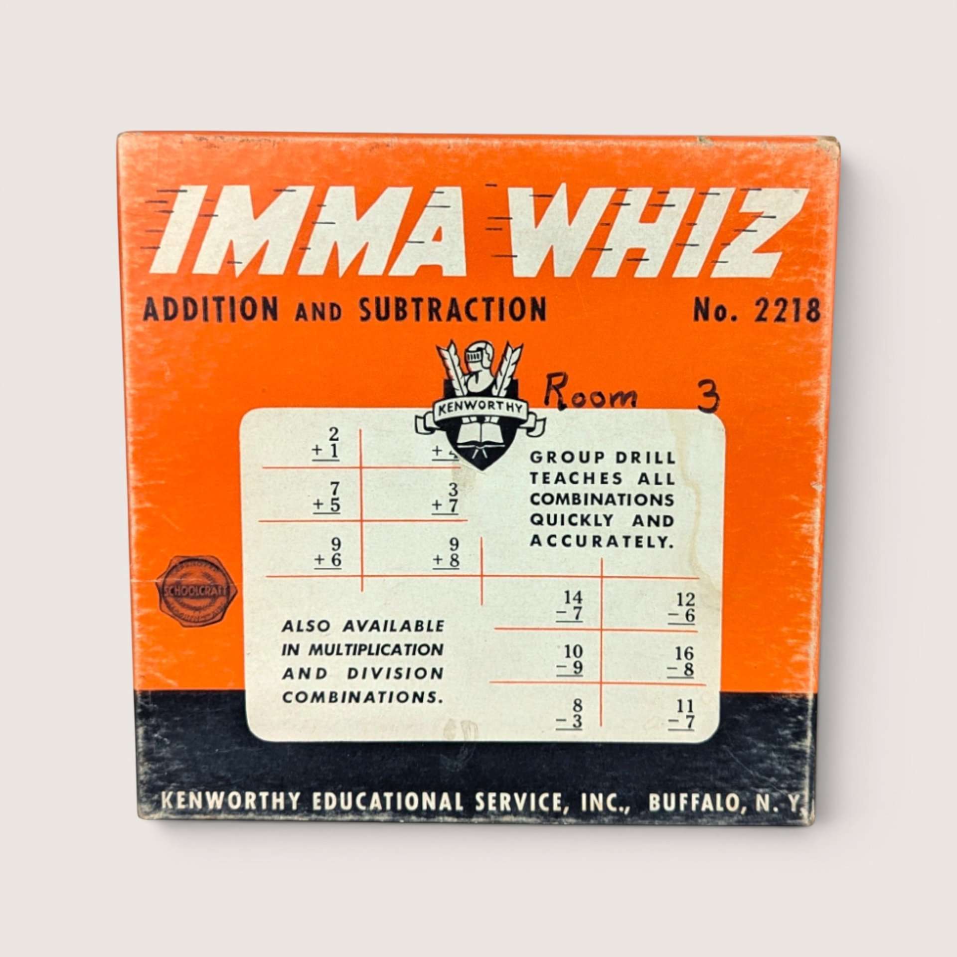 Vintage Imma Whiz game box in bright orange and black featuring math equations and schoolhouse branding.