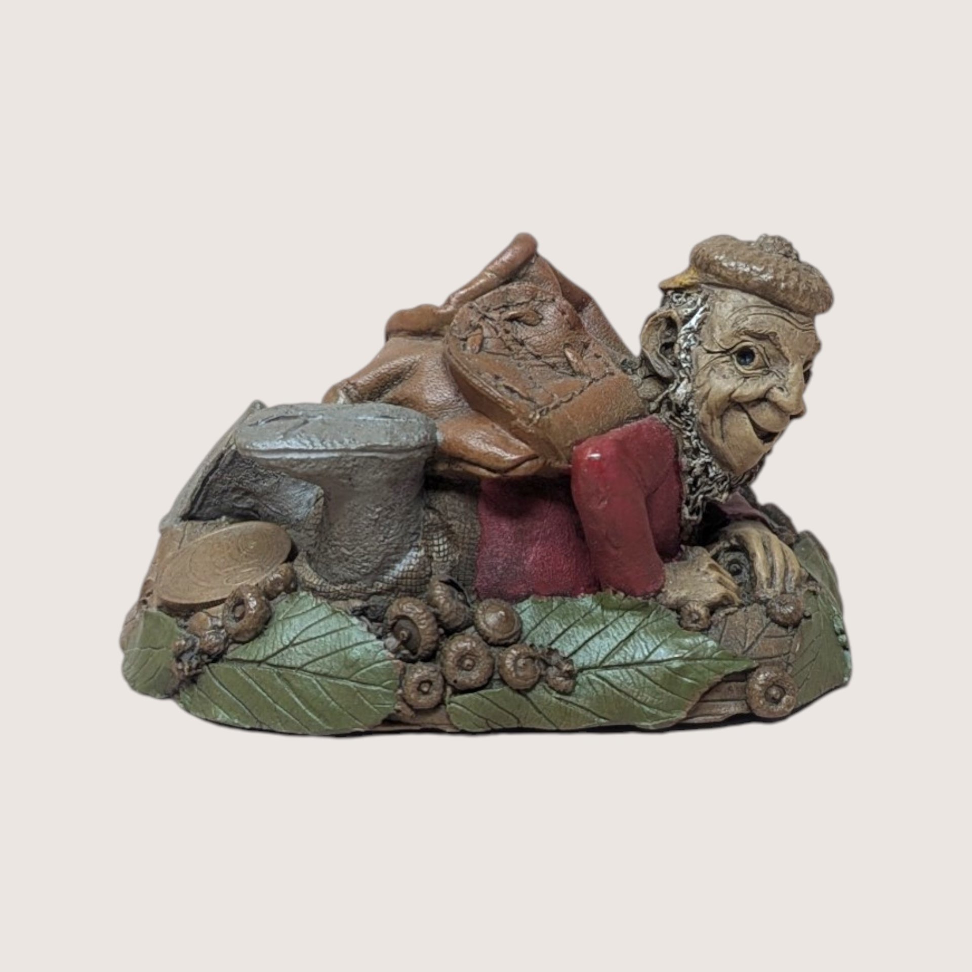 1996 Tom Clark signed Turtle gnome figurine crawling with a leather backpack on a linen background