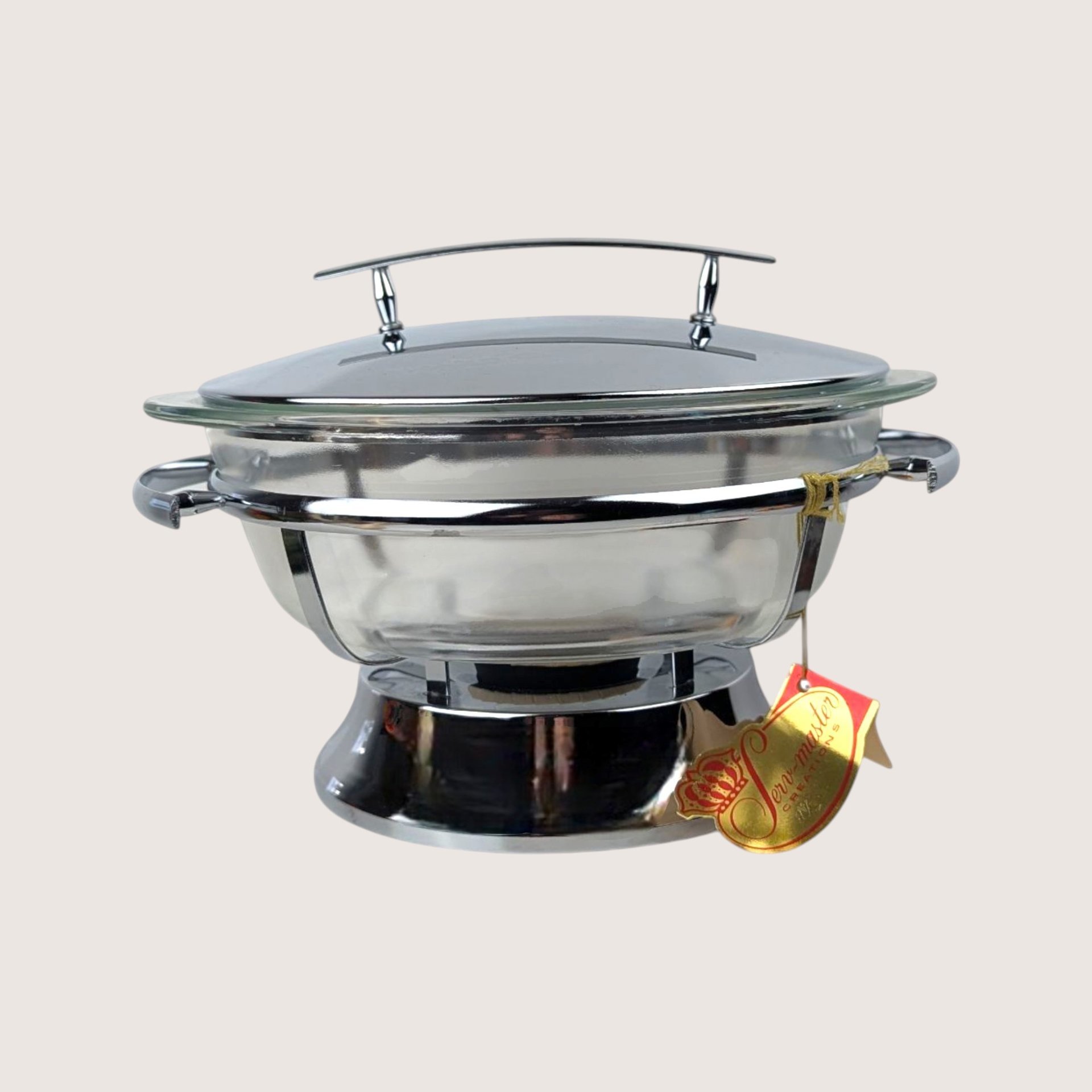 Vintage Serv Master chrome chafing dish with a clear glass casserole bowl and hanging gold paper retail tag.