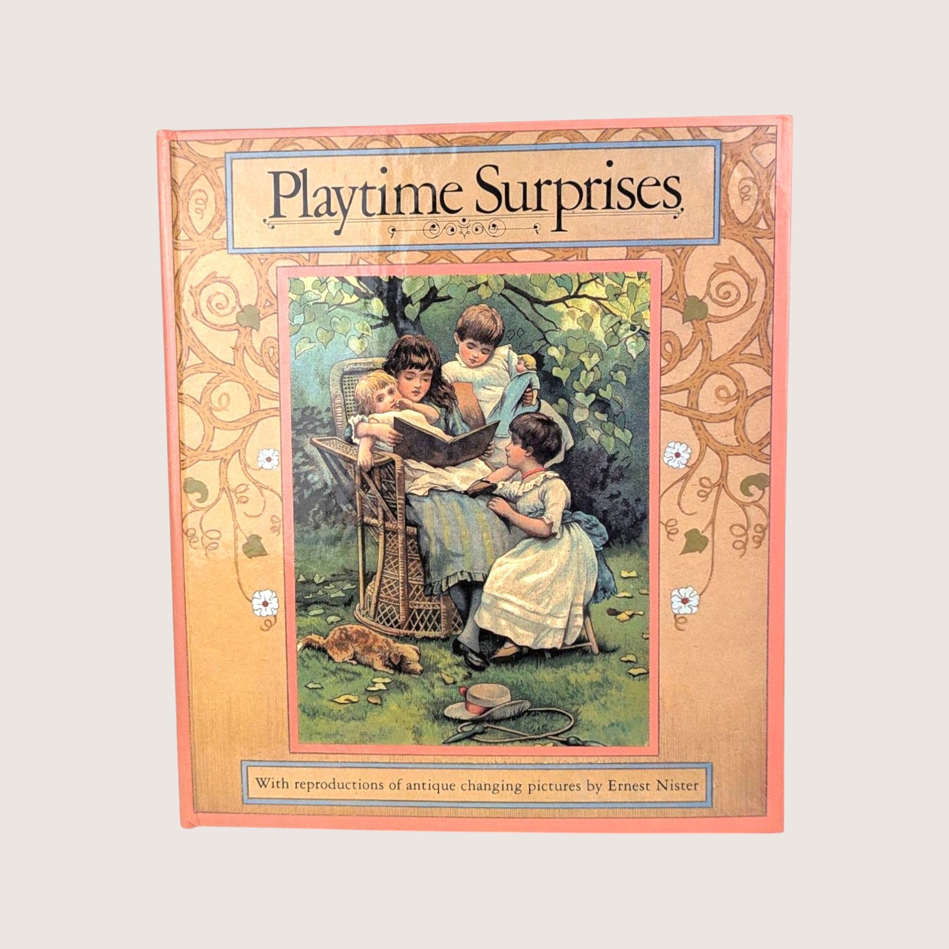 A vintage hardcover interactive children's book cover featuring an illustration of Victorian children reading outdoors.