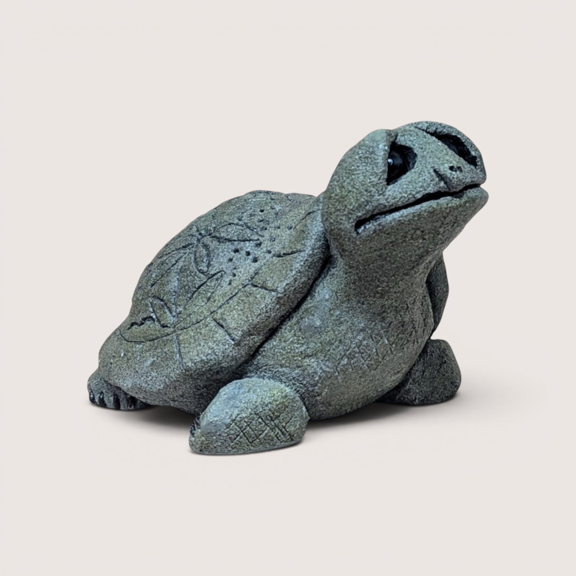 Vintage 1993 stone textured Lou Rankin Slowpoke turtle figurine with large eyes looking upward.