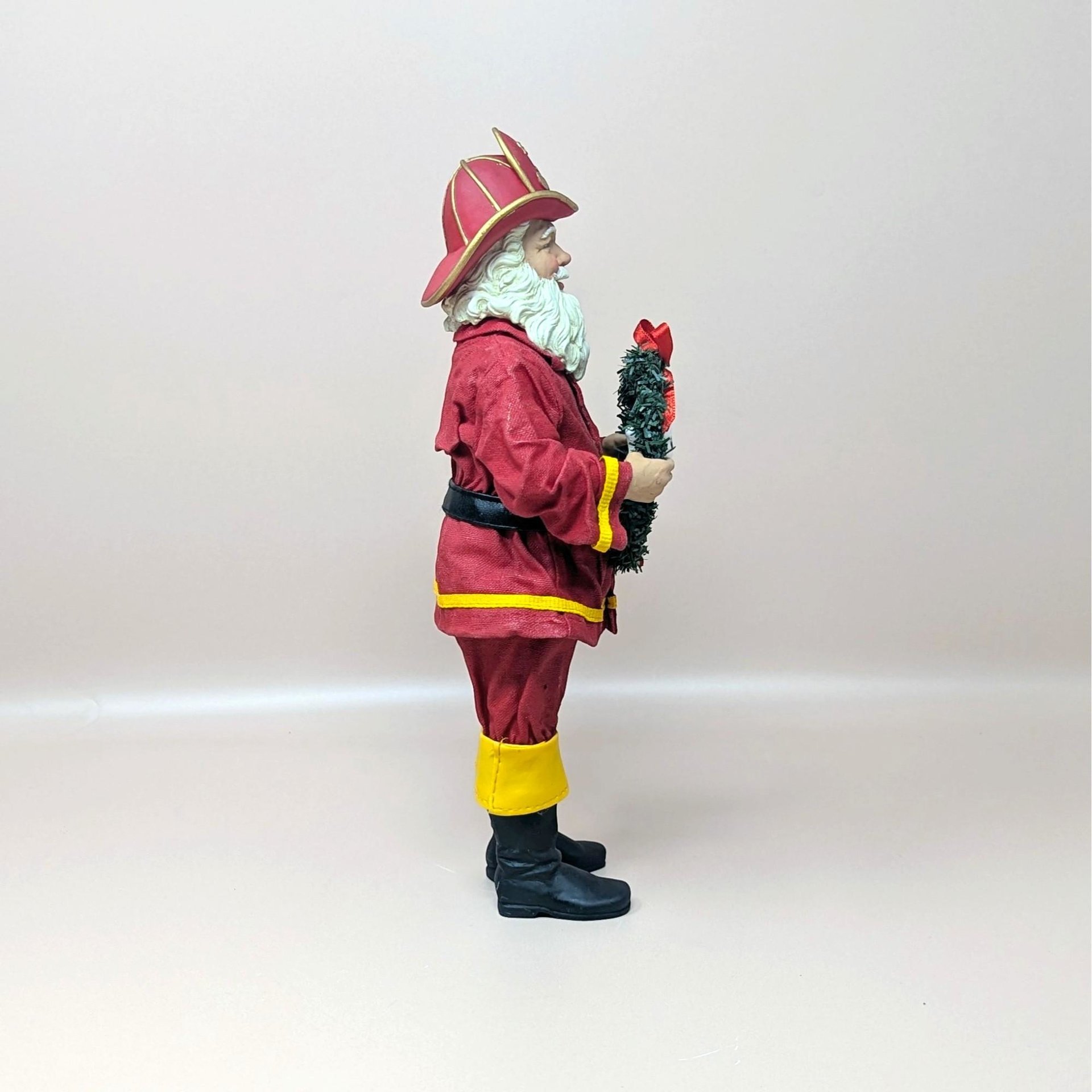1990s Fabriche Fireman Santa Holding Wreath Figurine