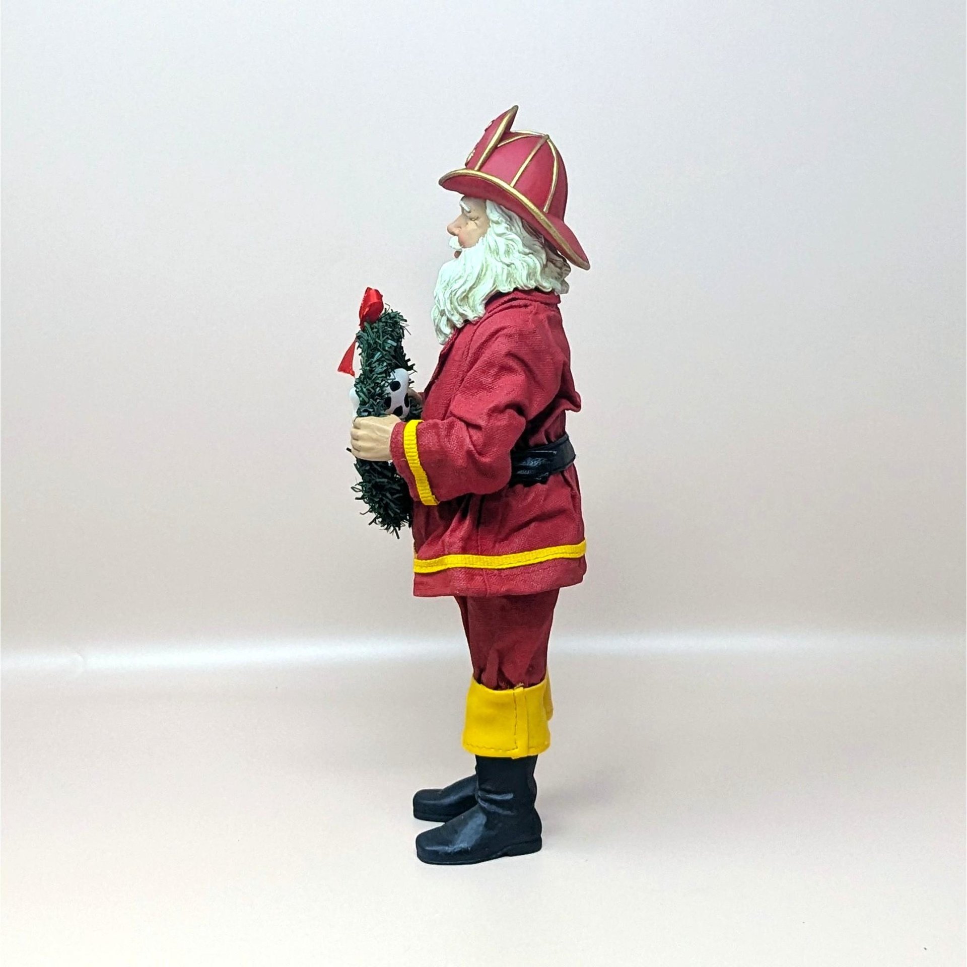 1990s Fabriche Fireman Santa Holding Wreath Figurine