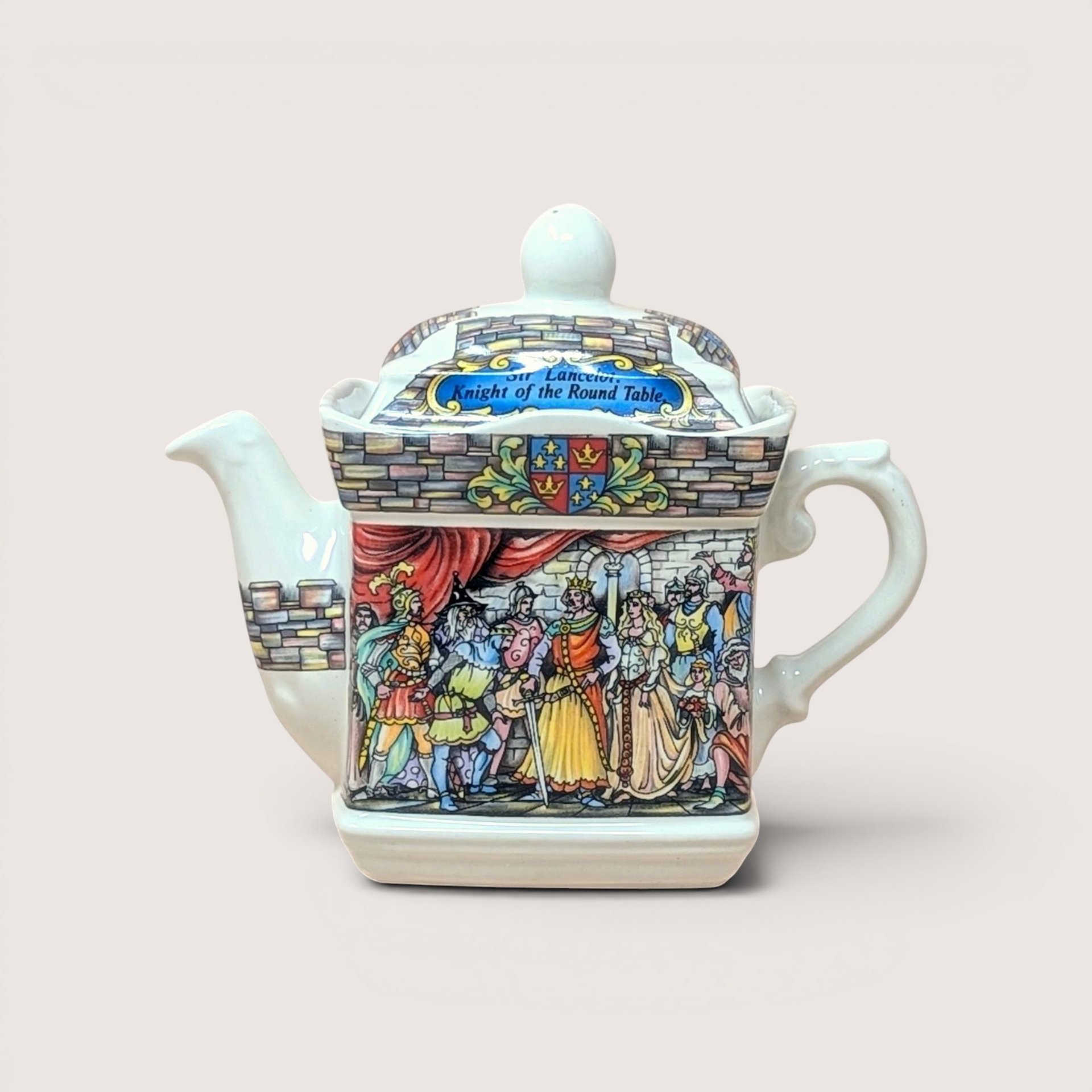 Vintage 1990s Sadler British porcelain teapot featuring colorful illustrations of King Arthur's Camelot and Sir Lancelot.