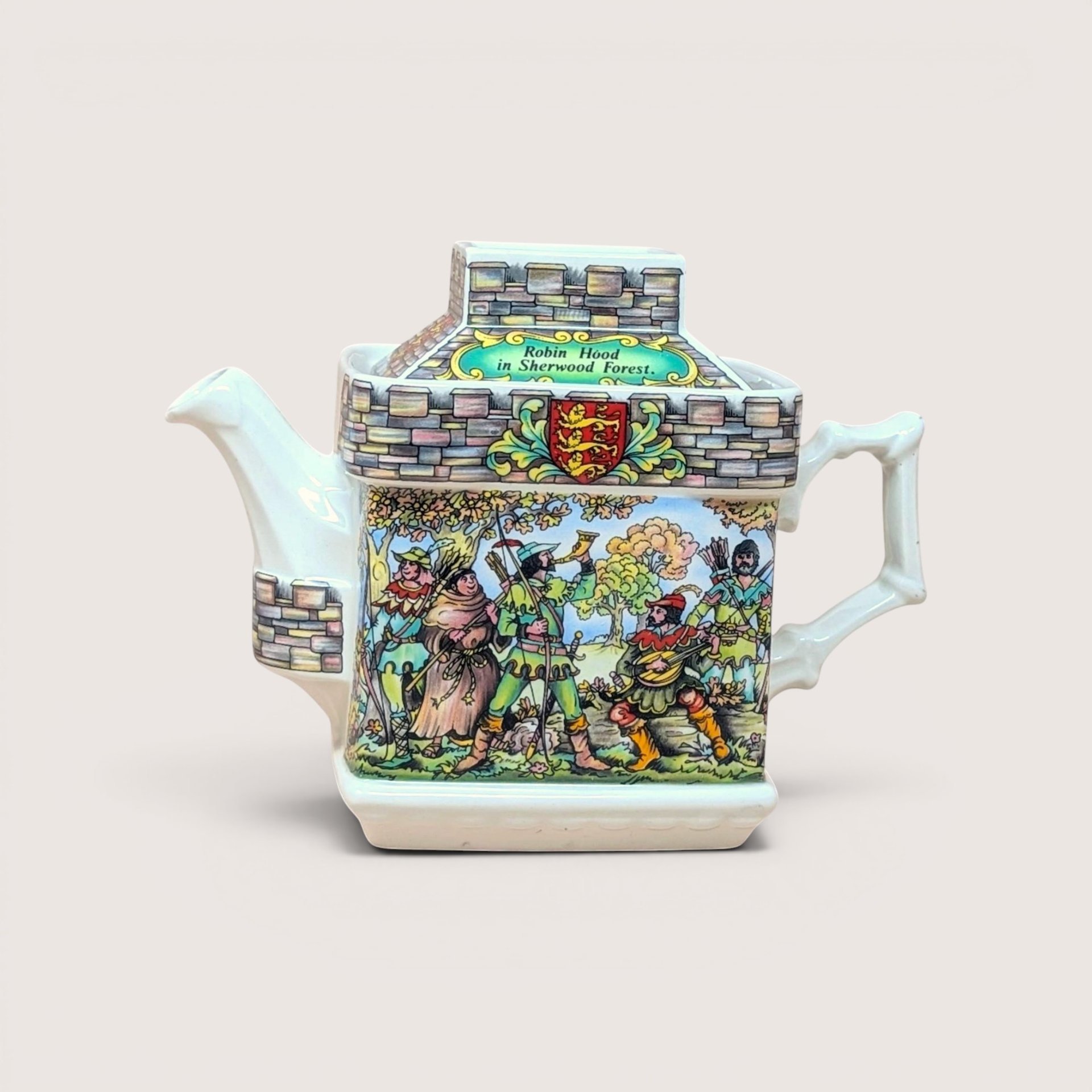 Vintage Sadler English porcelain castle-shaped teapot featuring a colorful illustration of Robin Hood in Sherwood Forest.  