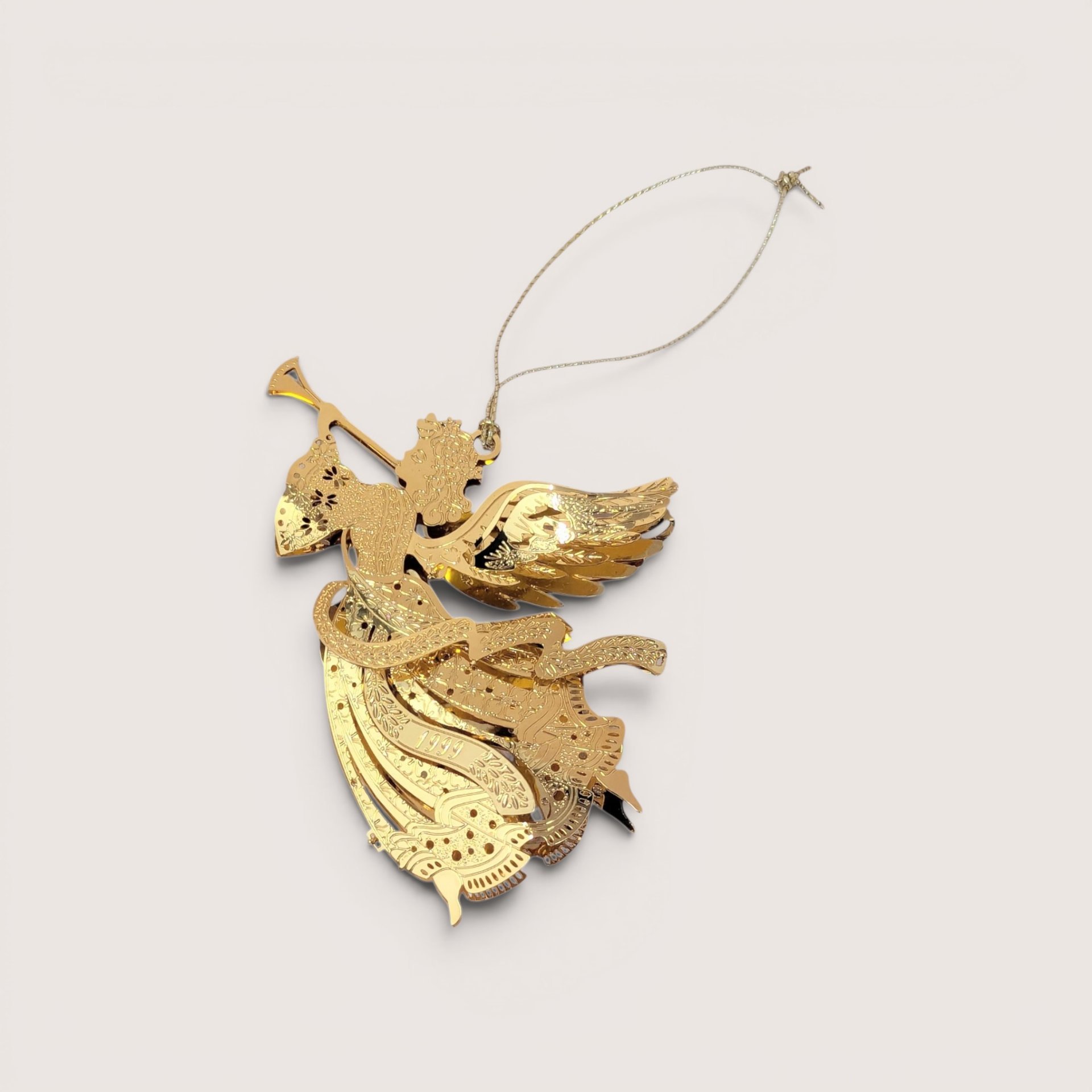 Intricate 1999 Danbury Mint gold plated Christmas ornament featuring a herald angel with a horn