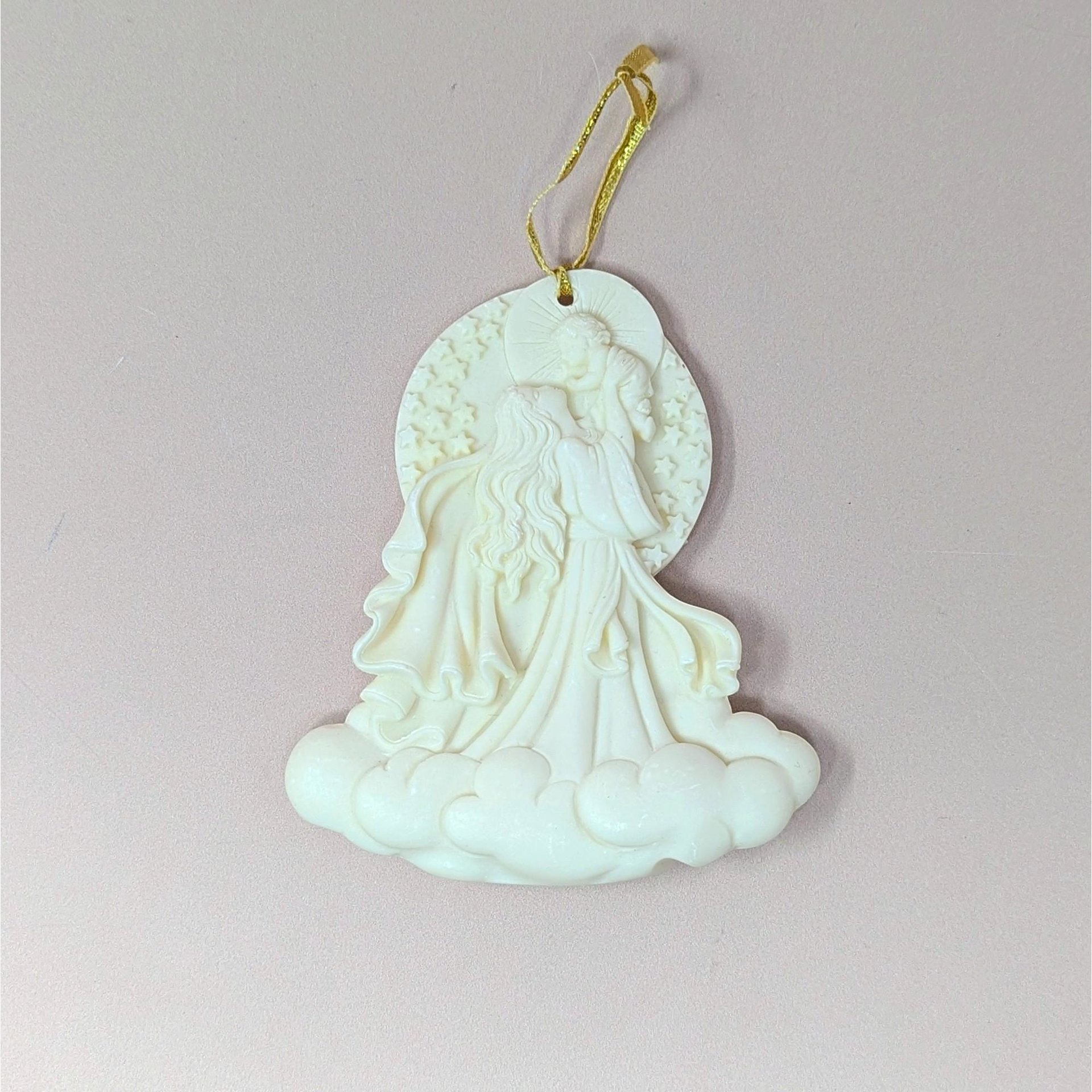 A 2000 Roman Inc "Cause of Our Joy" Millennium Series ornament on a soft pink background. The cream-colored resin cameo style sculpture depicts a flowing Madonna figure raising the infant Christ child into the sky above a base of billowy clouds.