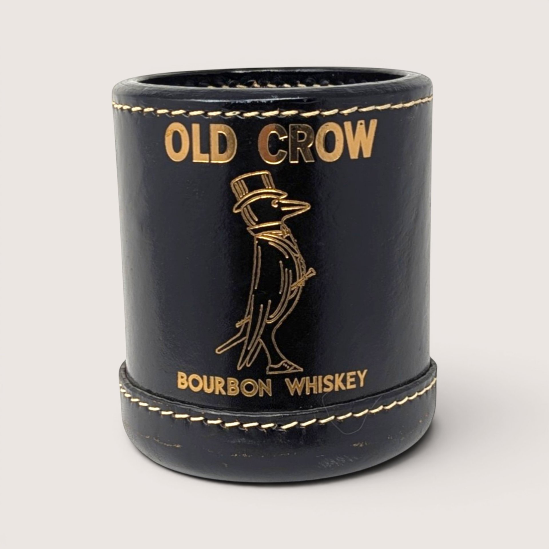 Vintage black faux leather Old Crow Bourbon Whiskey dice cup with gold embossed dapper crow logo.