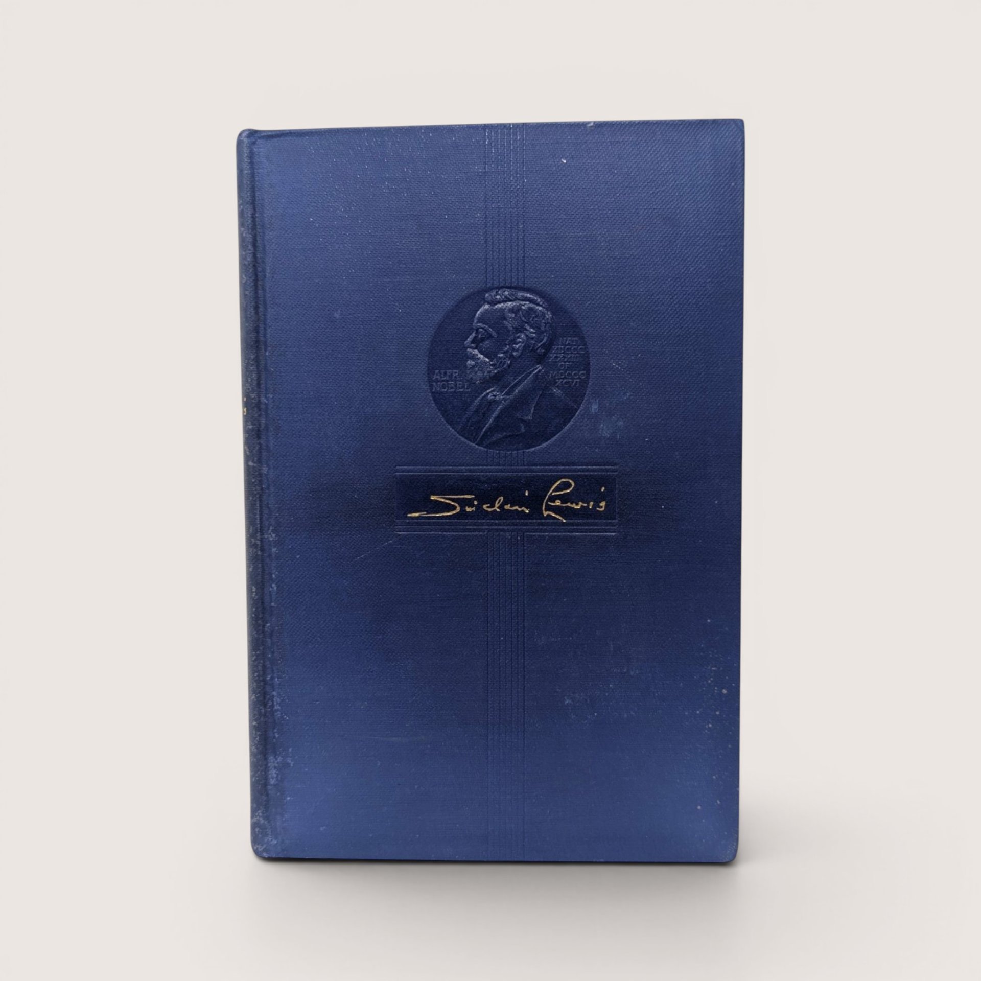 Vintage P. F. Collier hardcover book Babbitt by Sinclair Lewis with blue embossed cover.