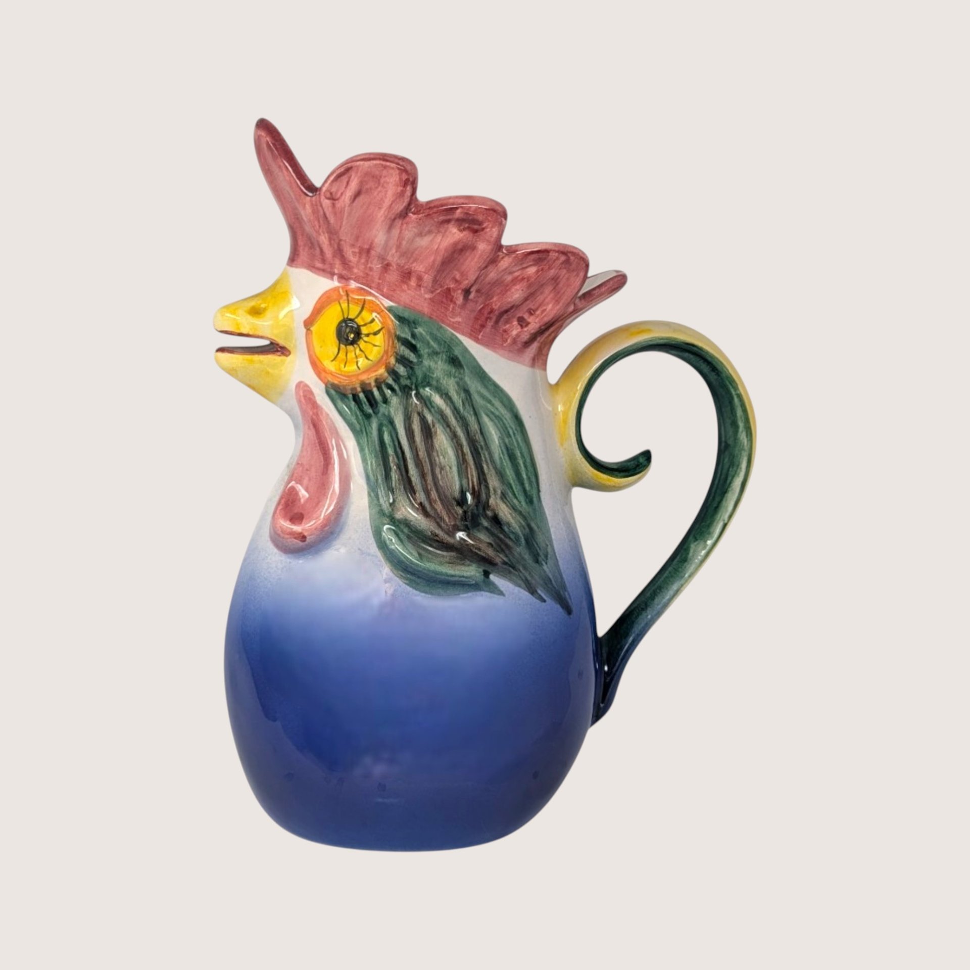 Vintage hand-painted ceramic rooster pitcher from Portugal with vibrant blue, red, and green glaze.