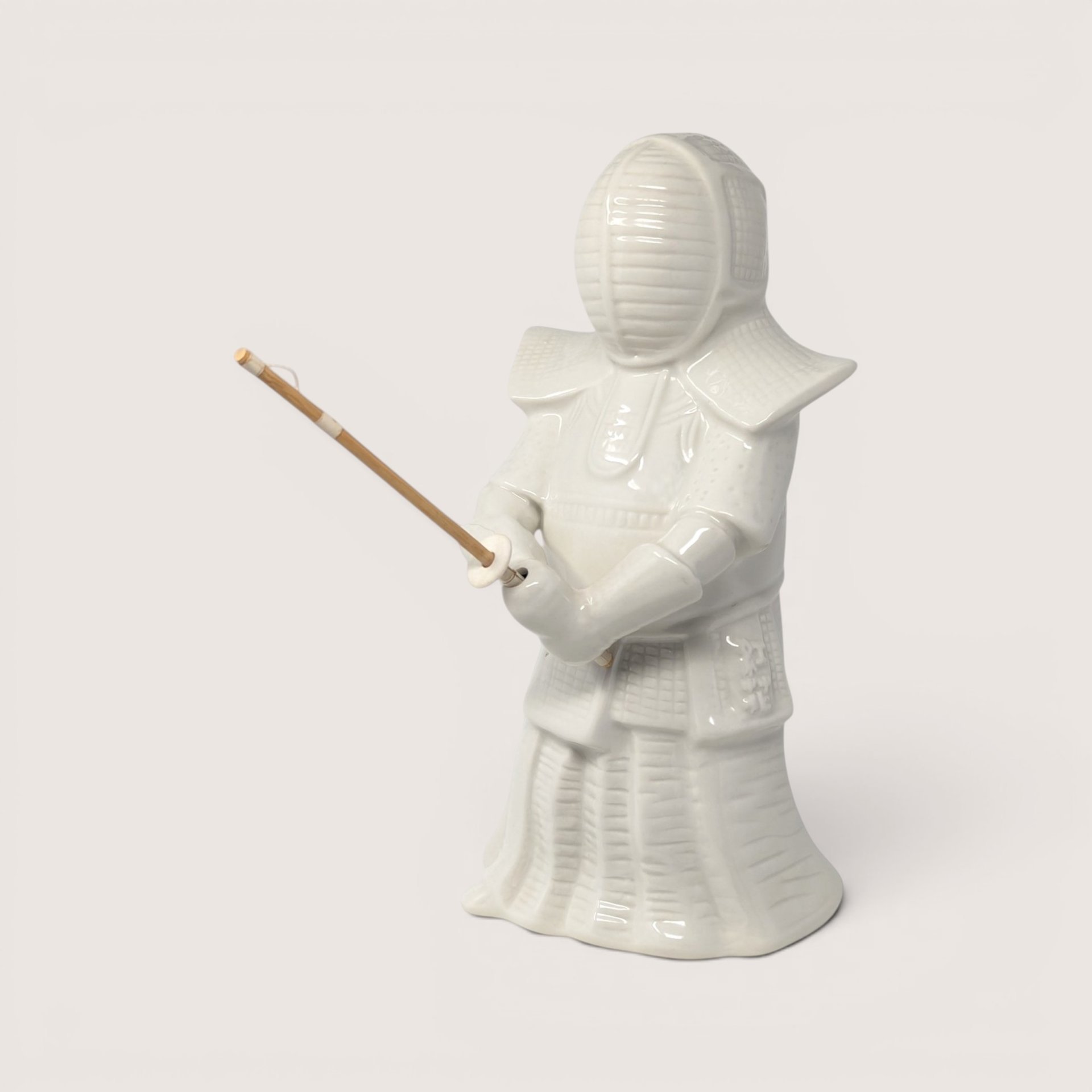 Vintage white ceramic Benihana Kendo warrior figurine with embossed branding on the back.