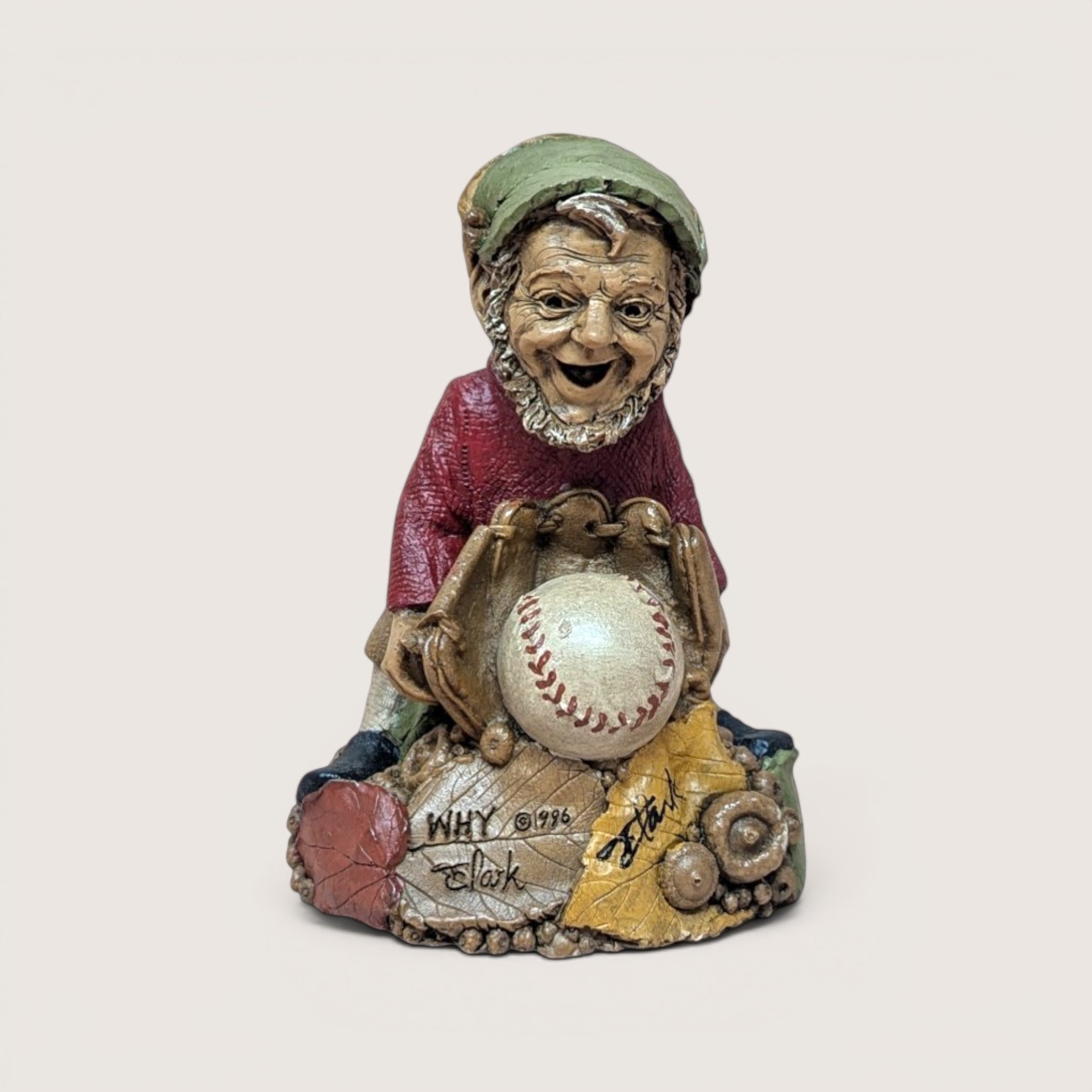 Vintage signed Tom Clark "Why" gnome figurine holding a baseball with autumn leaf base.