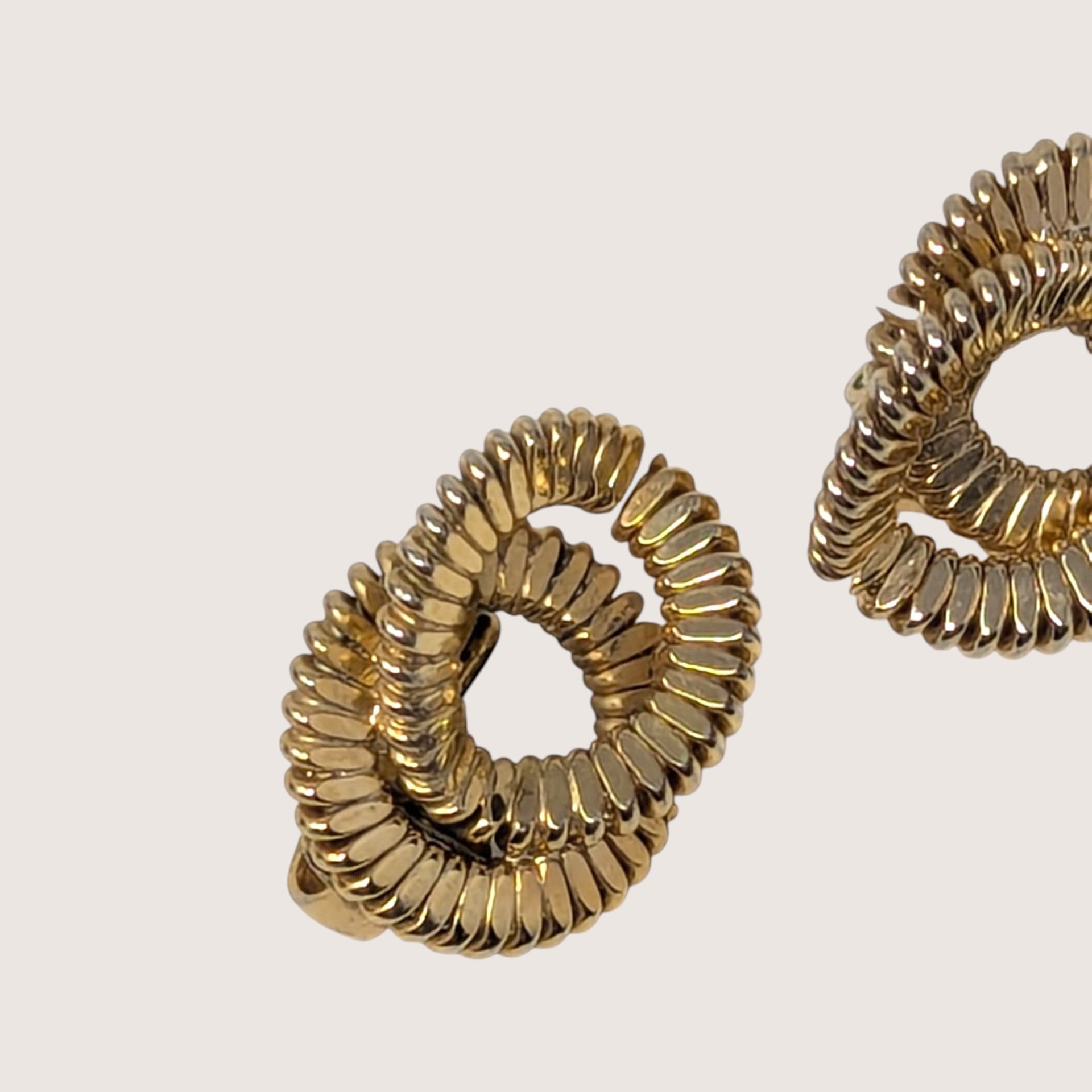 1980s Textured Gold Tone Swirl Clip On Earrings