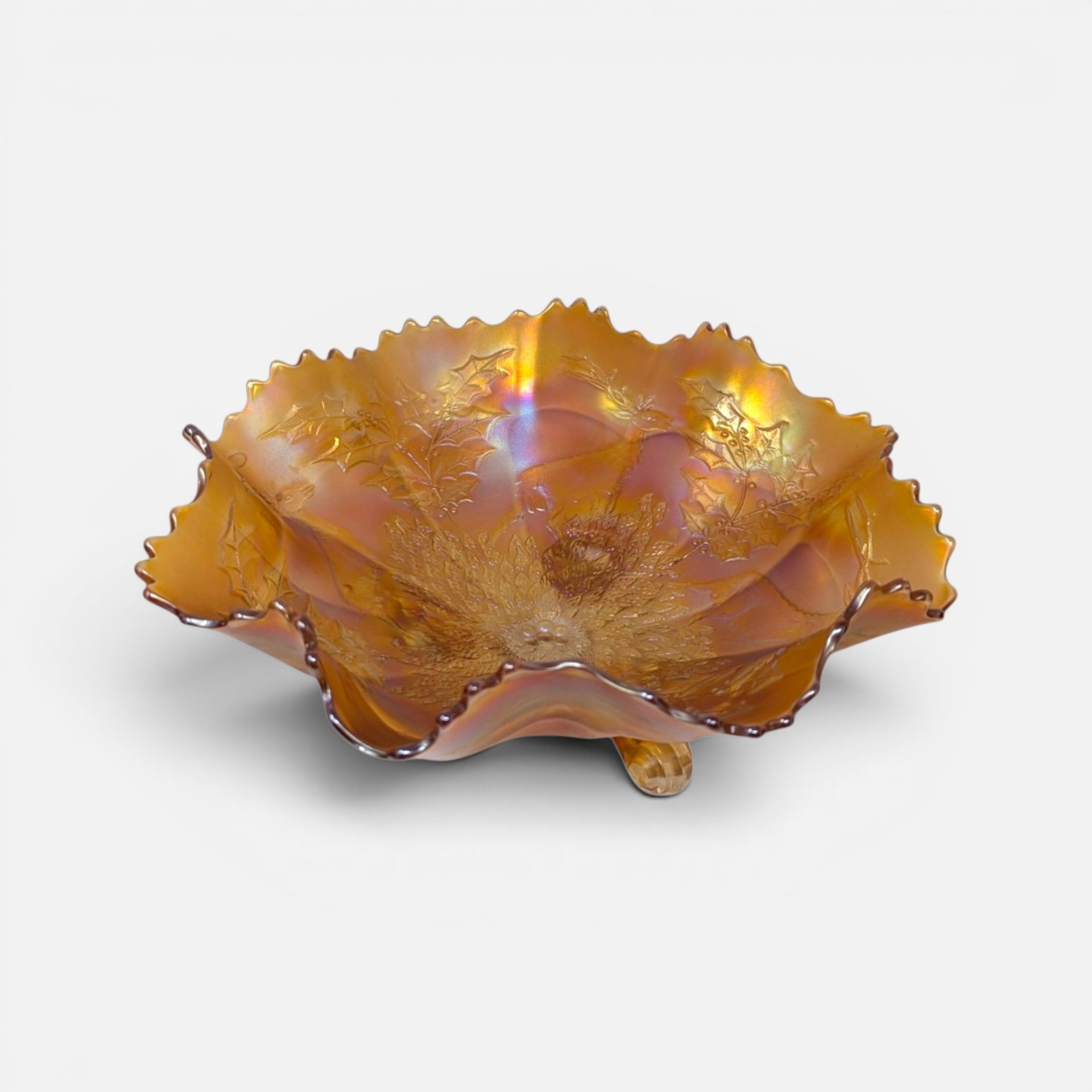 Antique 1910s Fenton marigold carnival glass footed bowl with embossed Chrysanthemum motif and crimped ruffle rim.