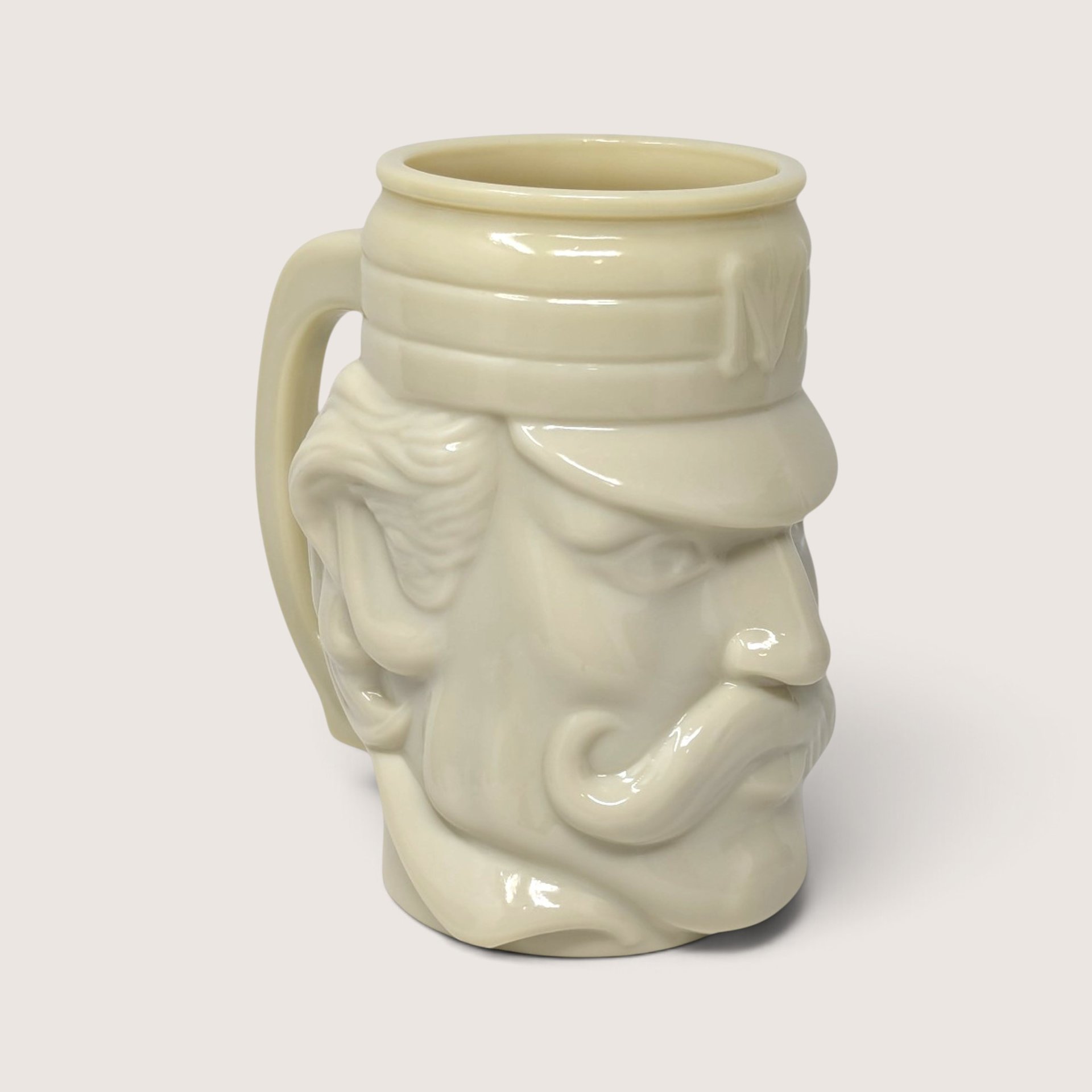 Vintage 1970s Avon cream glazed ceramic novelty character mug of a vintage baseball player with cap and mustache.