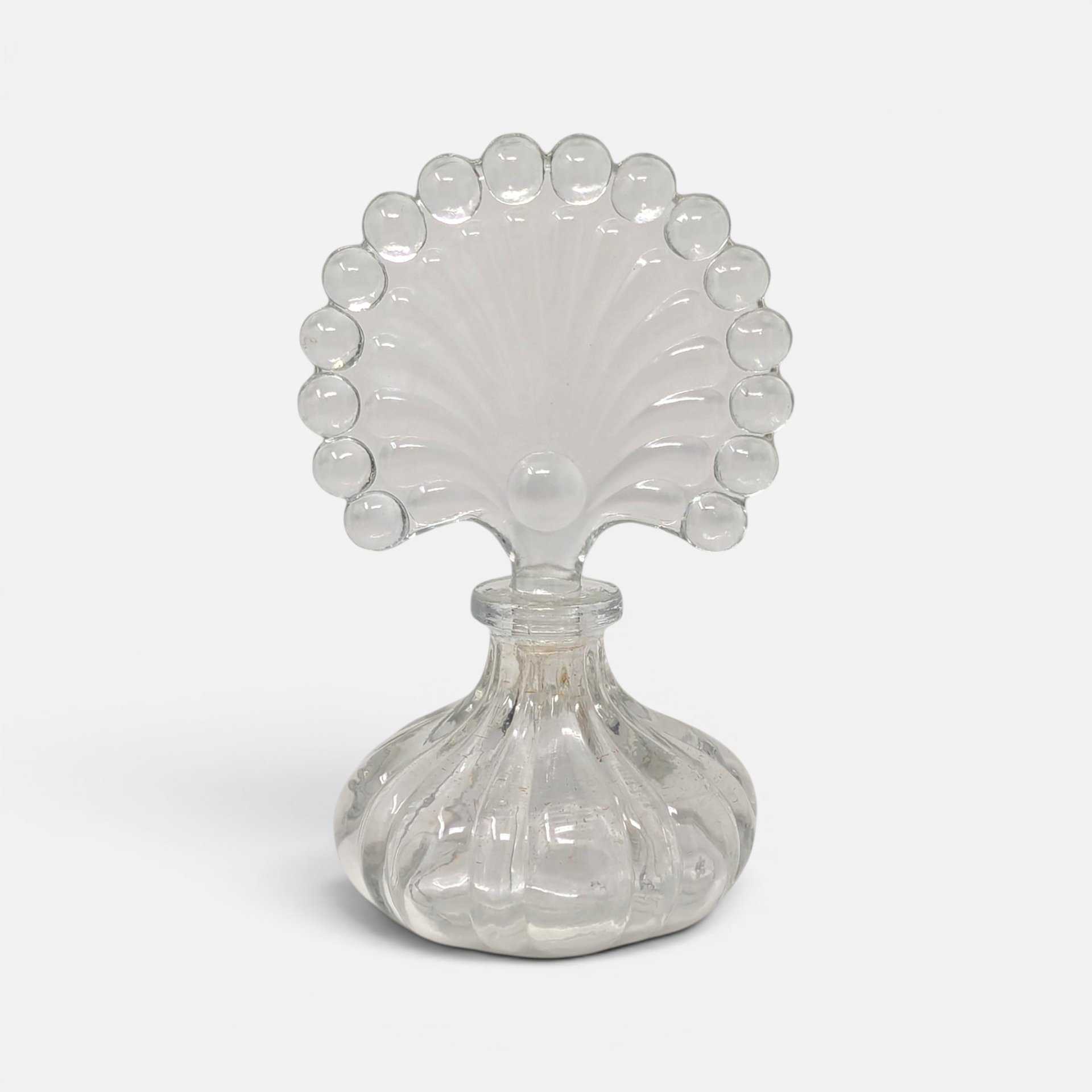 Vintage clear glass ribbed melon perfume bottle with large beaded fan shaped glass stopper
