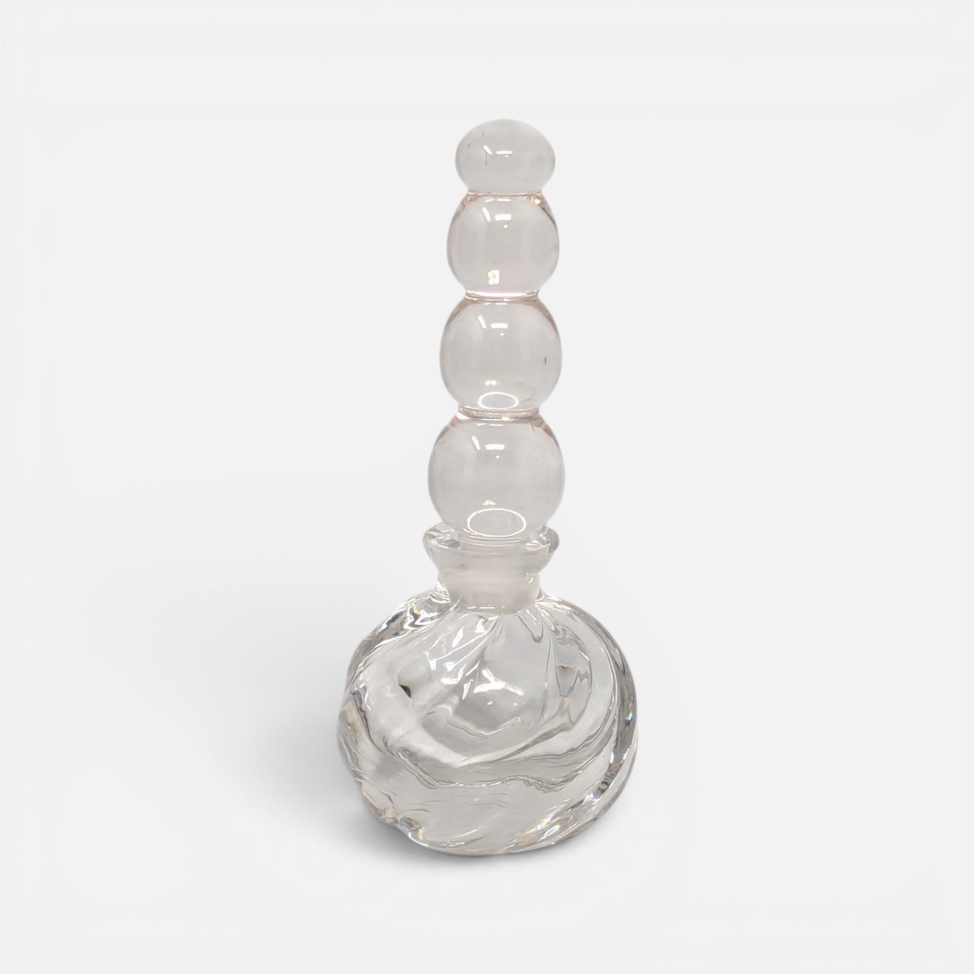 Vintage clear swirl glass perfume bottle with a tall graduated stacked sphere bubble glass stopper