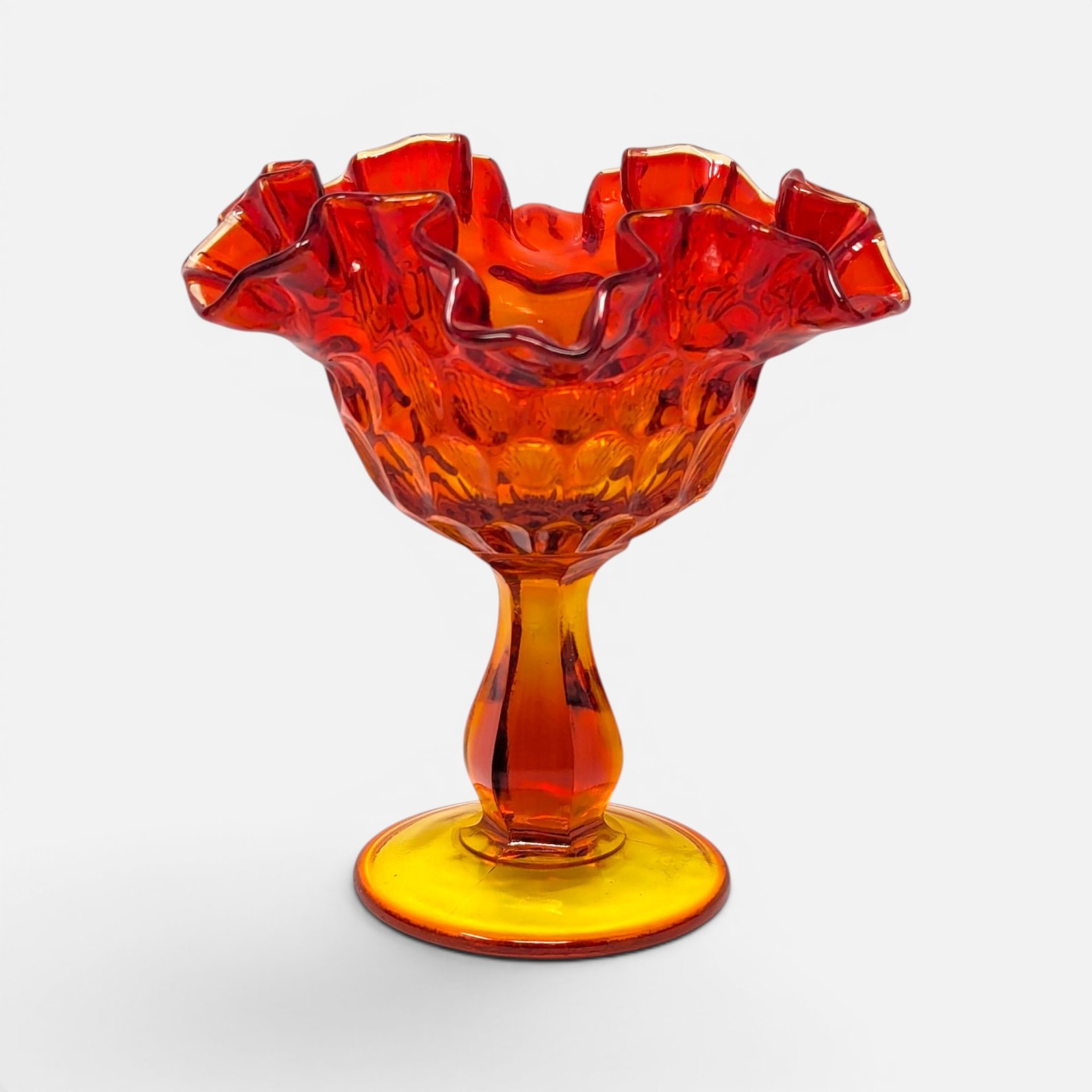 Vintage Fenton Amberina glass footed compote dish with ruffled edge and thumbprint pattern in red and yellow ombre