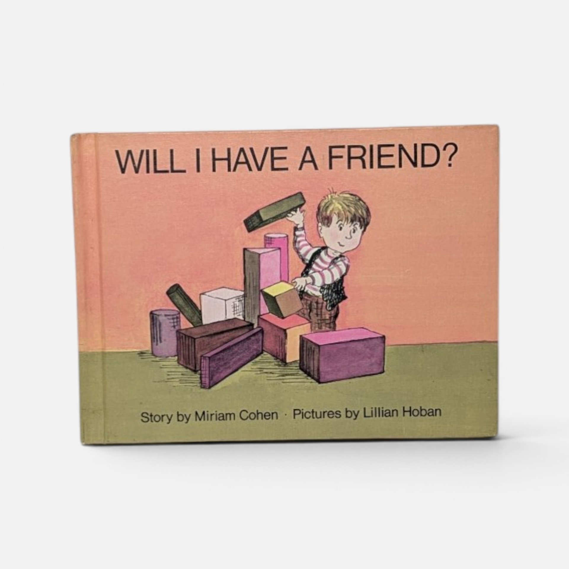 Vintage 1967 hardcover children's book Will I Have a Friend? by Miriam Cohen on a plain background.