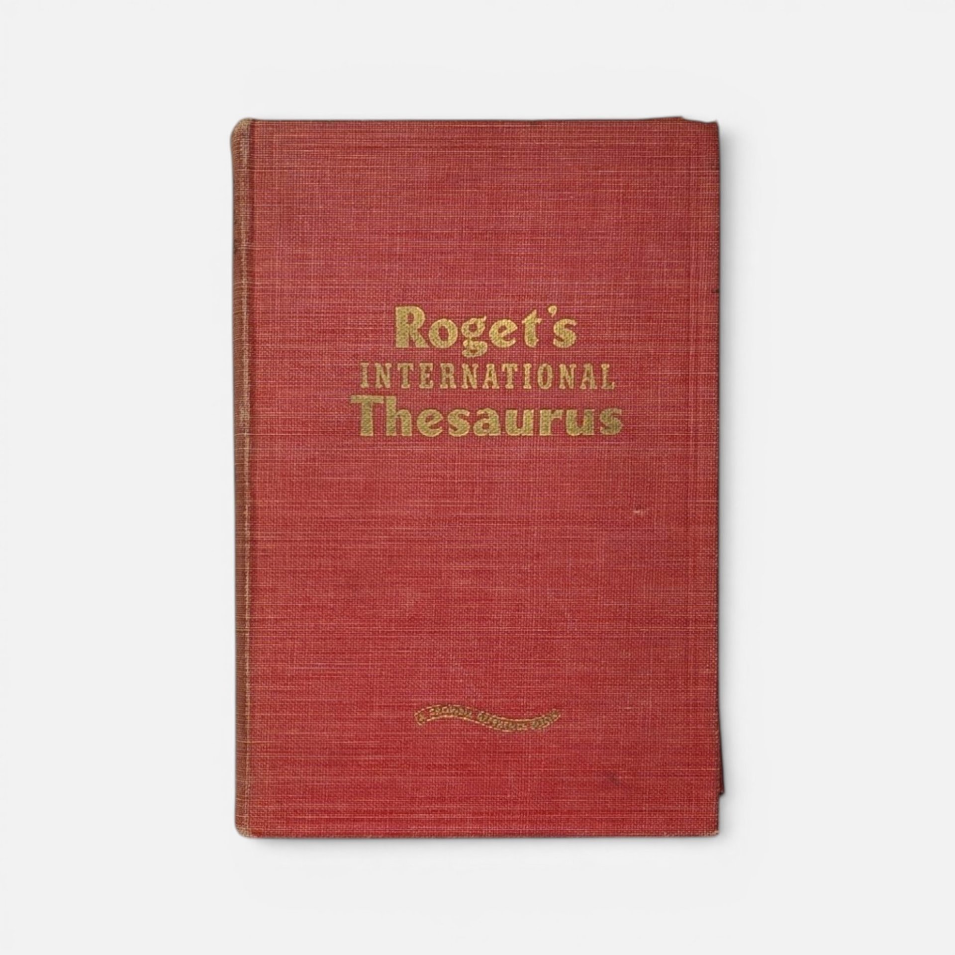 Vintage 1946 Roget's International Thesaurus hardcover in red cloth on a plain background.