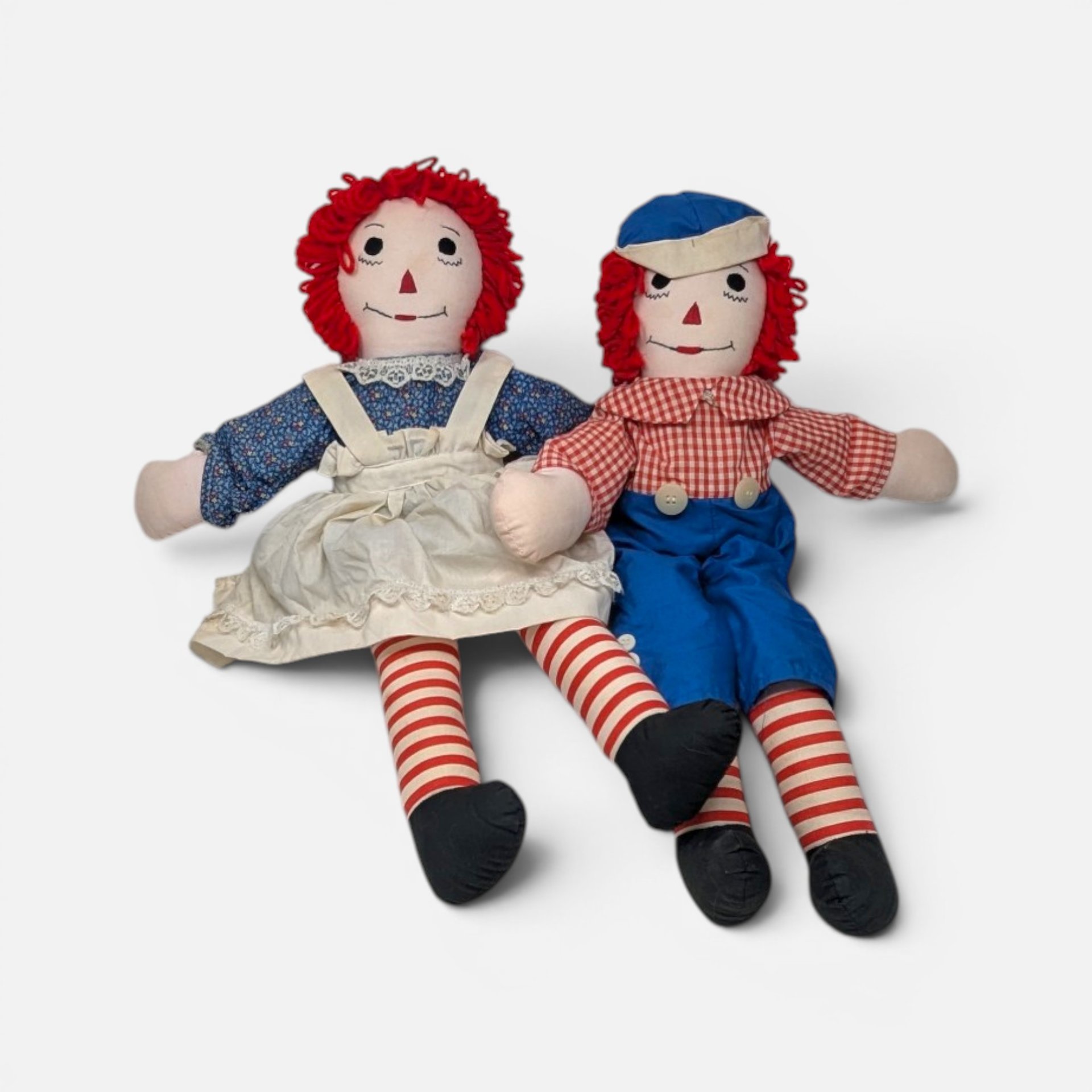 Handmade Raggedy Ann and Andy dolls from 2003 sitting side-by-side on a plain background.