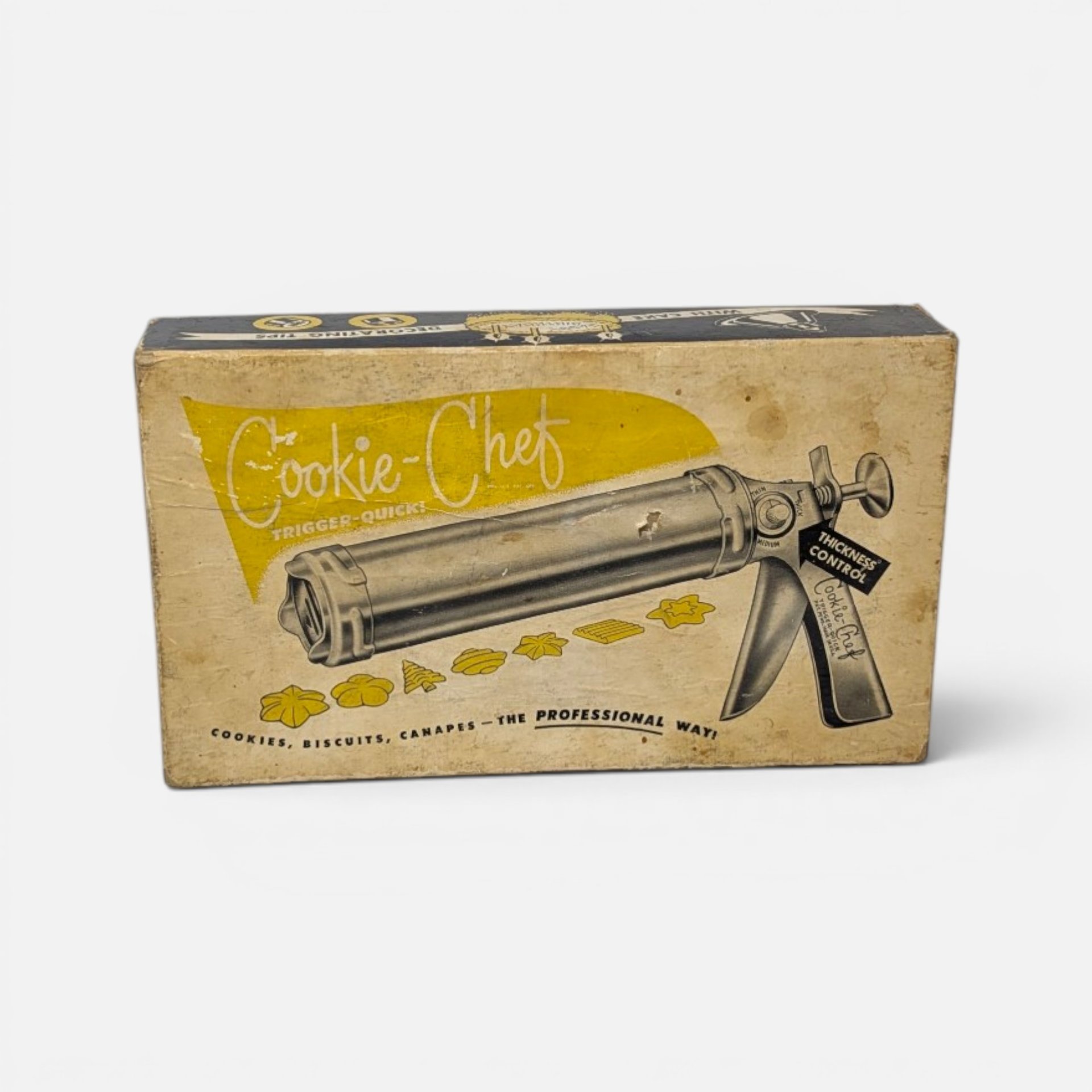 Vintage Cookie-Chef trigger-quick cookie press gun and accessories set in its original illustrated box.