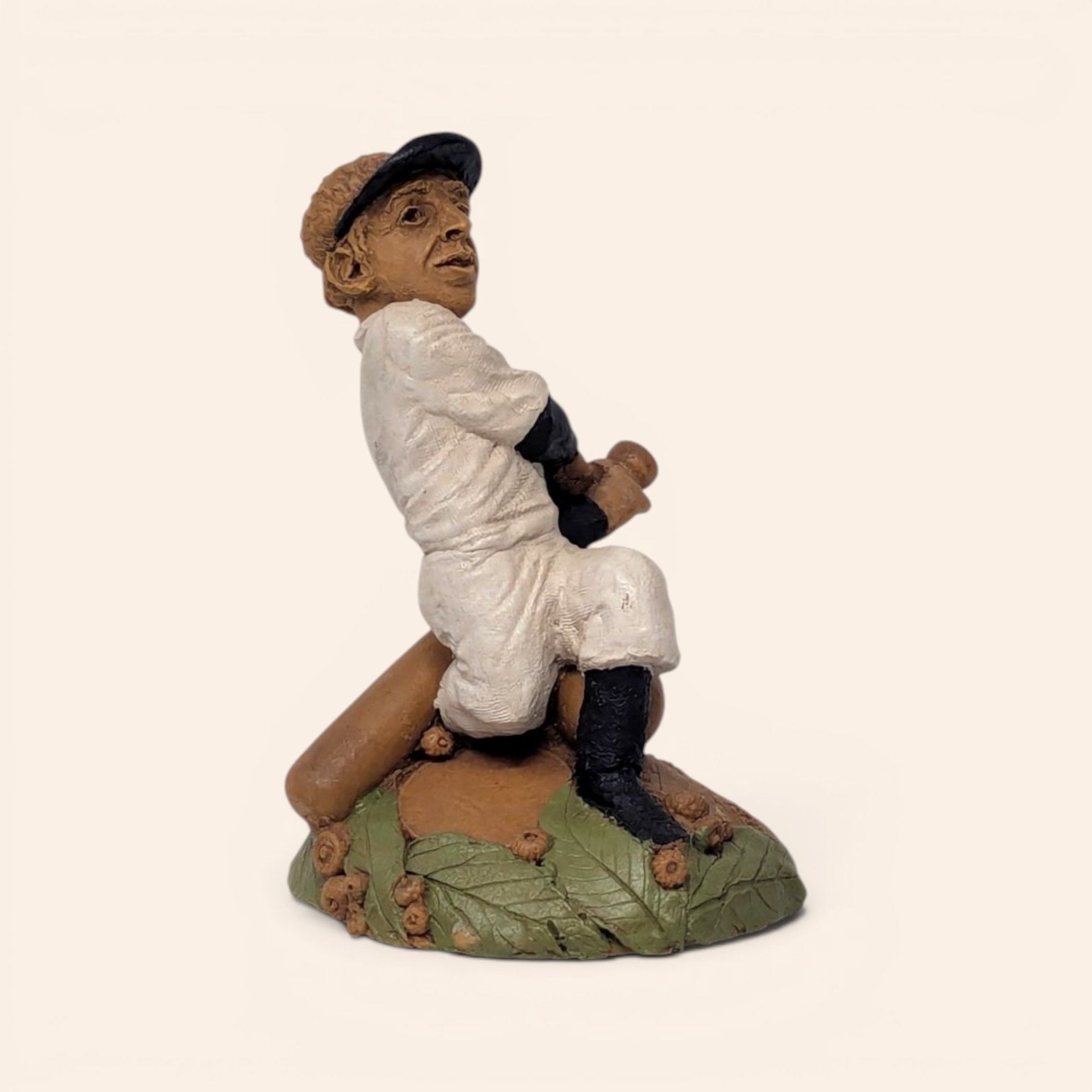 Vintage Tom Clark Cairn Studios Joltin Joe baseball figurine on a leaf base.