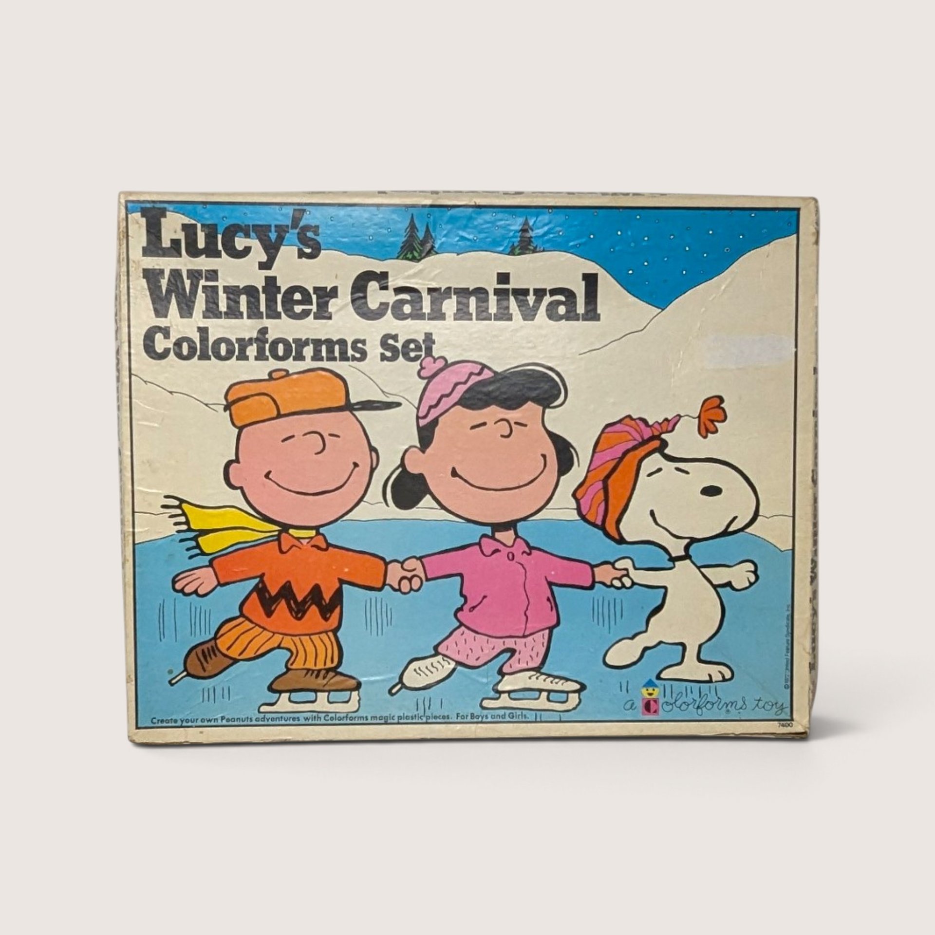 1972 vintage Lucy's Winter Carnival Colorforms box featuring Peanuts characters Charlie Brown, Lucy, and Snoopy ice skating.