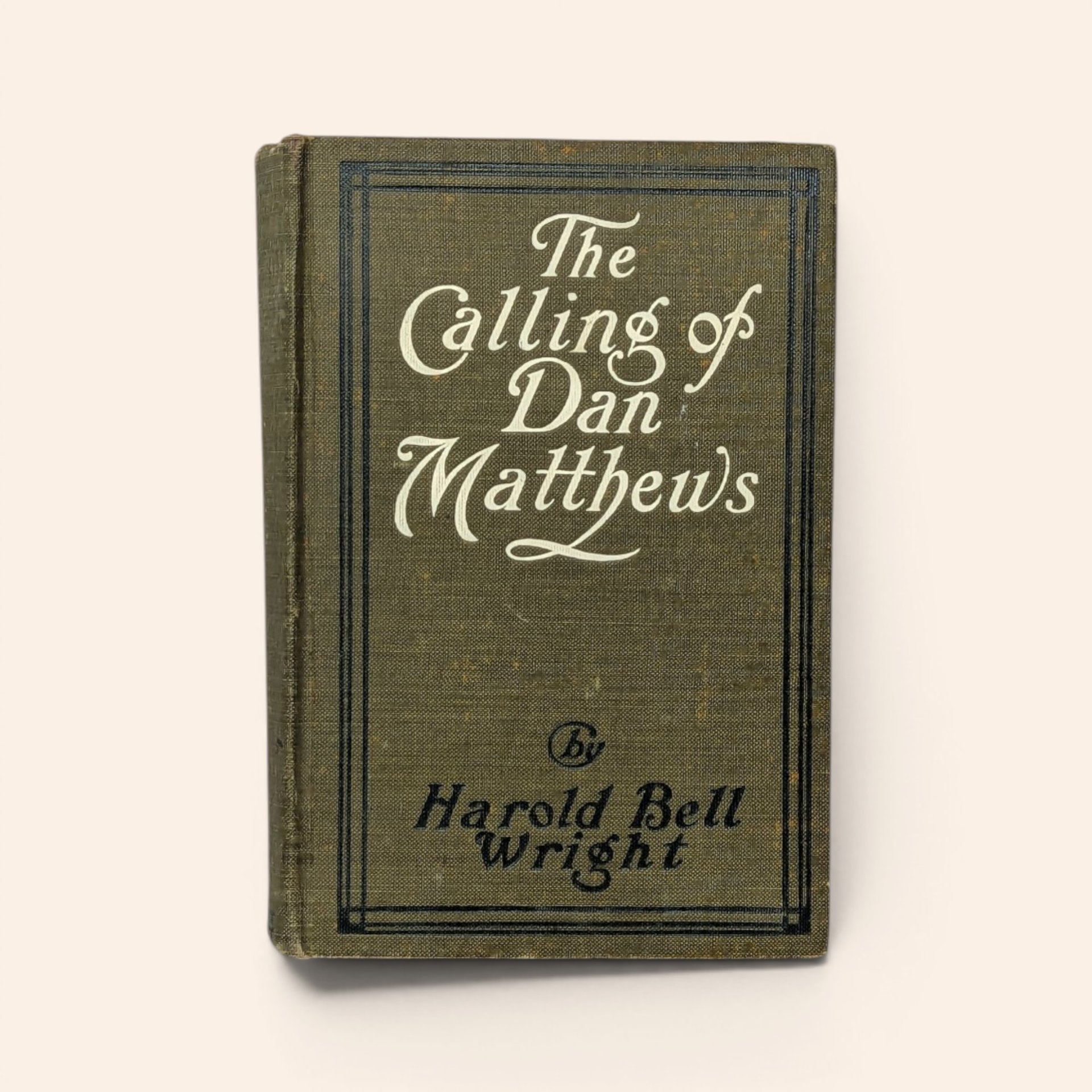 1909 hardcover book The Calling of Dan Matthews by Harold Bell Wright with olive green cloth cover.