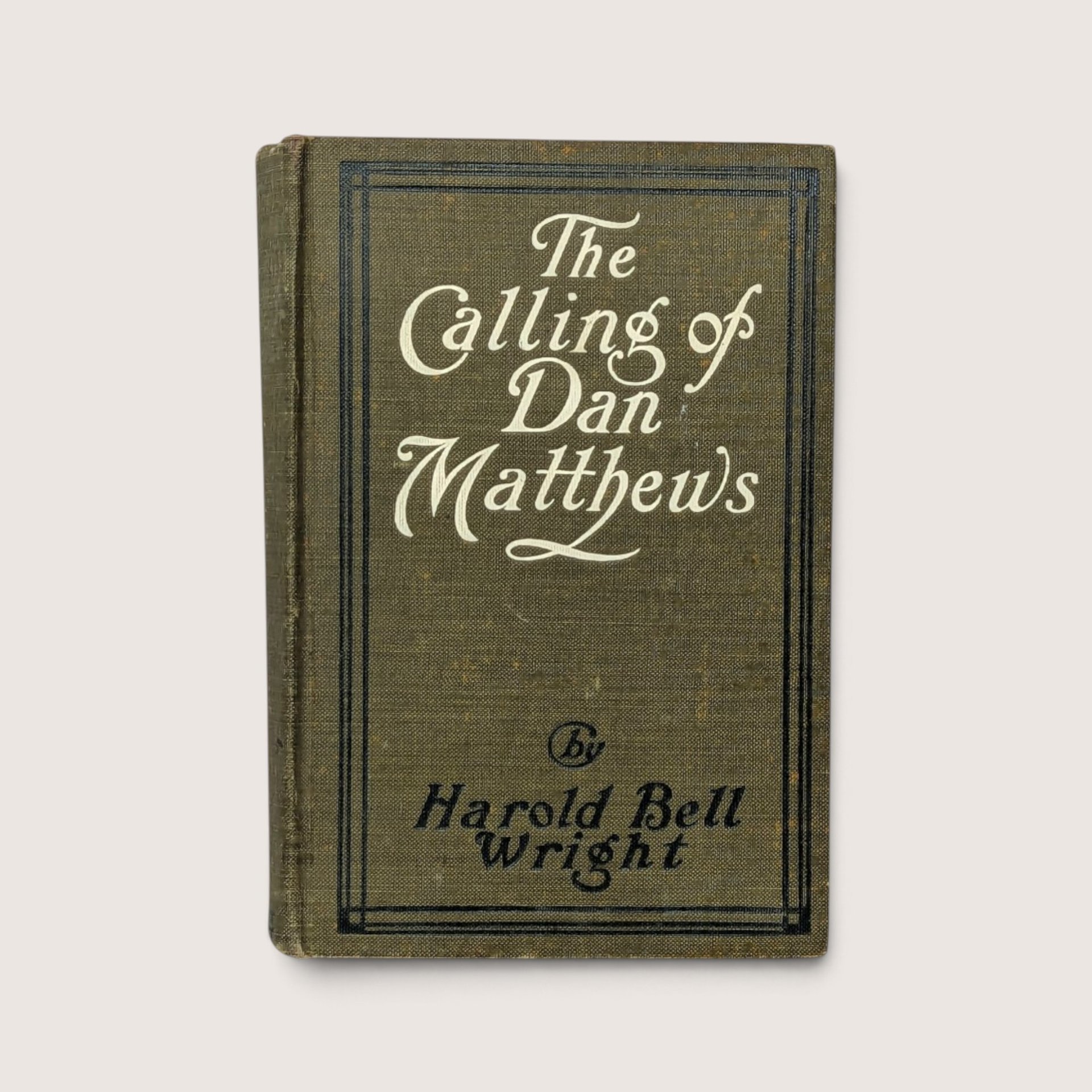 1909 hardcover book The Calling of Dan Matthews by Harold Bell Wright with olive green cloth cover.