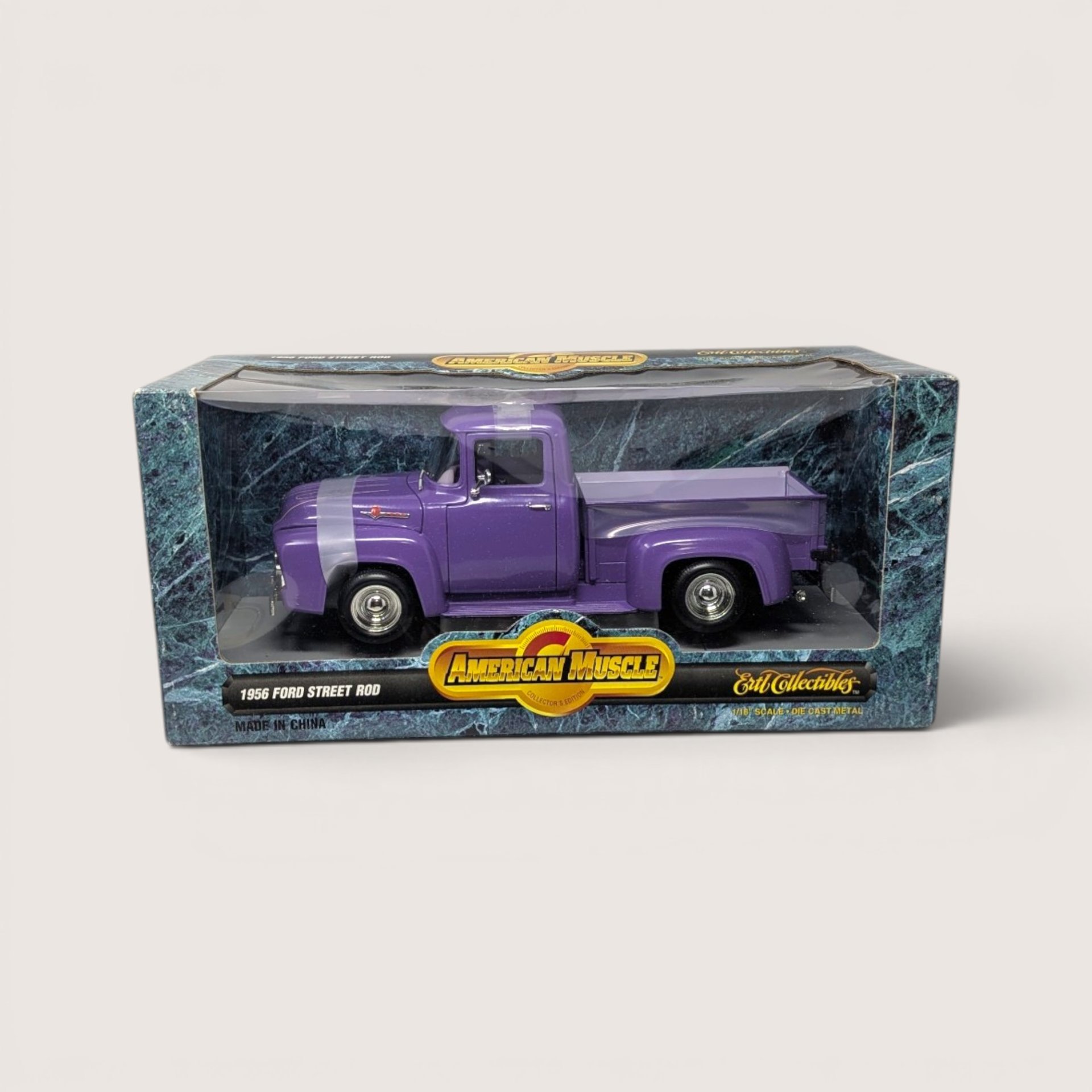 1997 ERTL American Muscle 1/18 scale purple 1956 Ford street rod truck inside its original box.