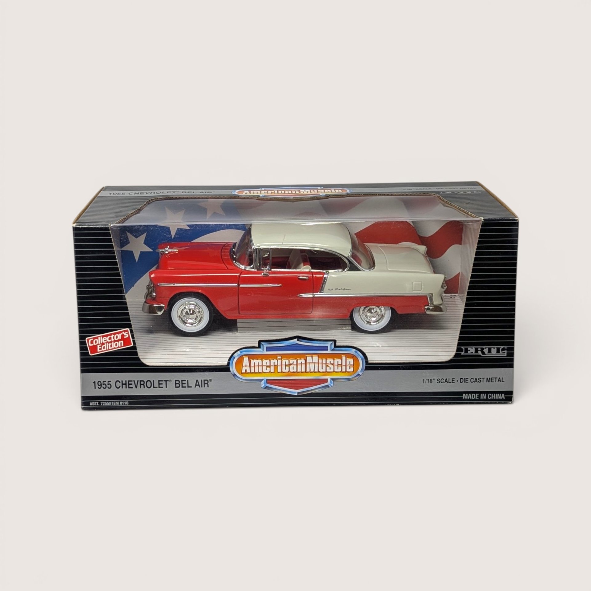 Vintage 1995 Ertl American Muscle red and white 1955 Chevrolet Bel Air die-cast vehicle in its original window box set against a plain linen background.