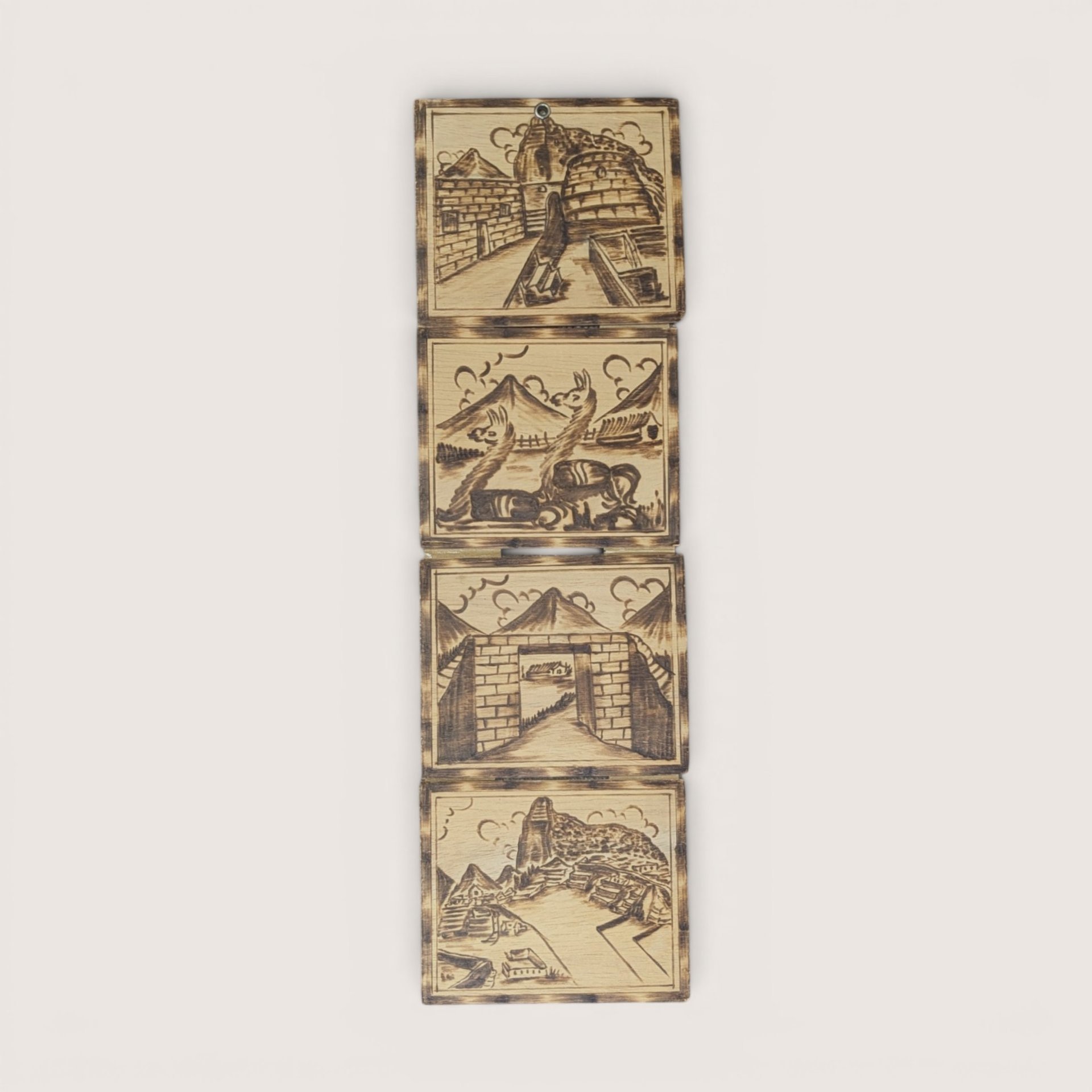 Vintage Peruvian wood burned hanging wall plaques featuring four connected panels with Incan scenes