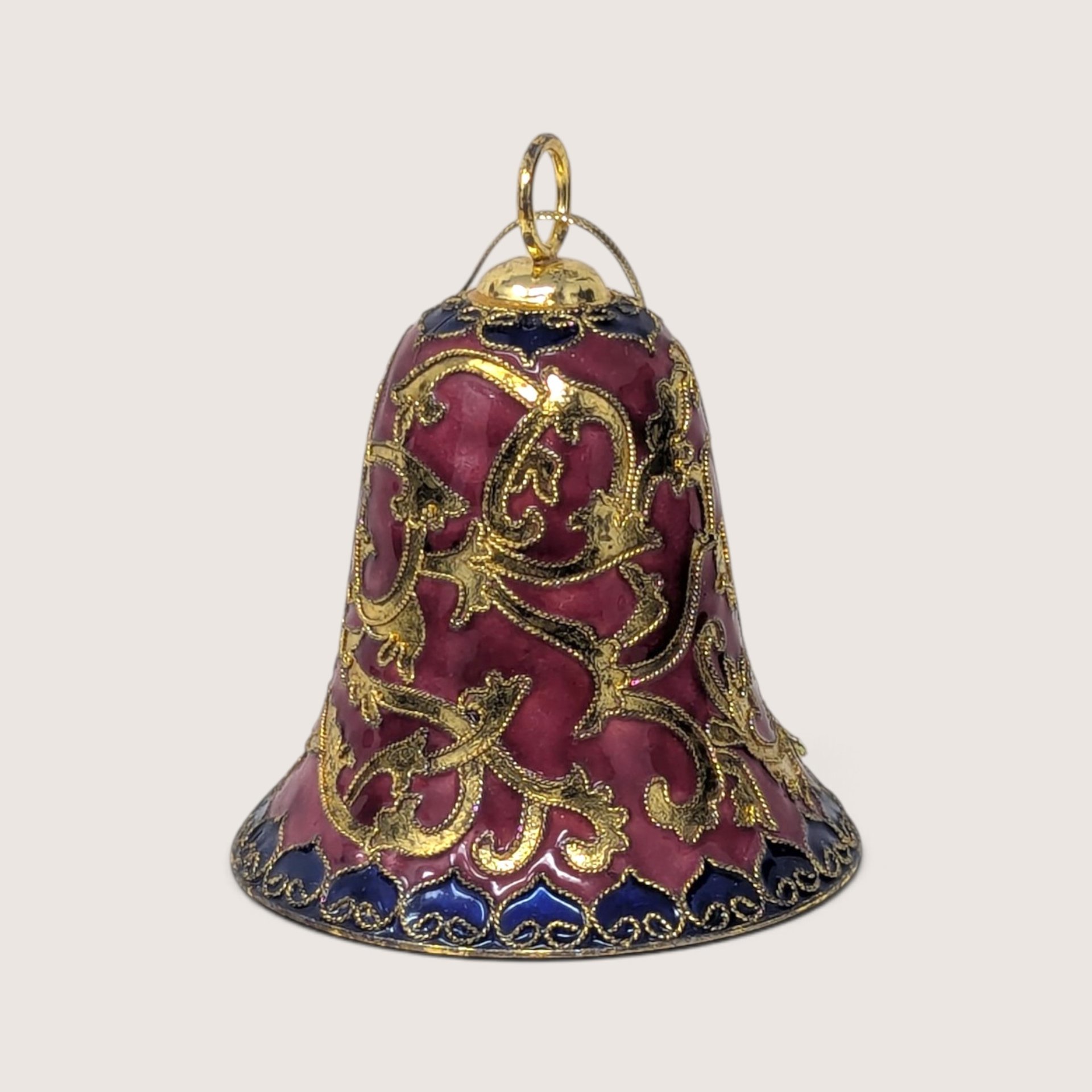 Vintage enameled metal bell Christmas ornament in burgundy and blue with gold filigree scrollwork
