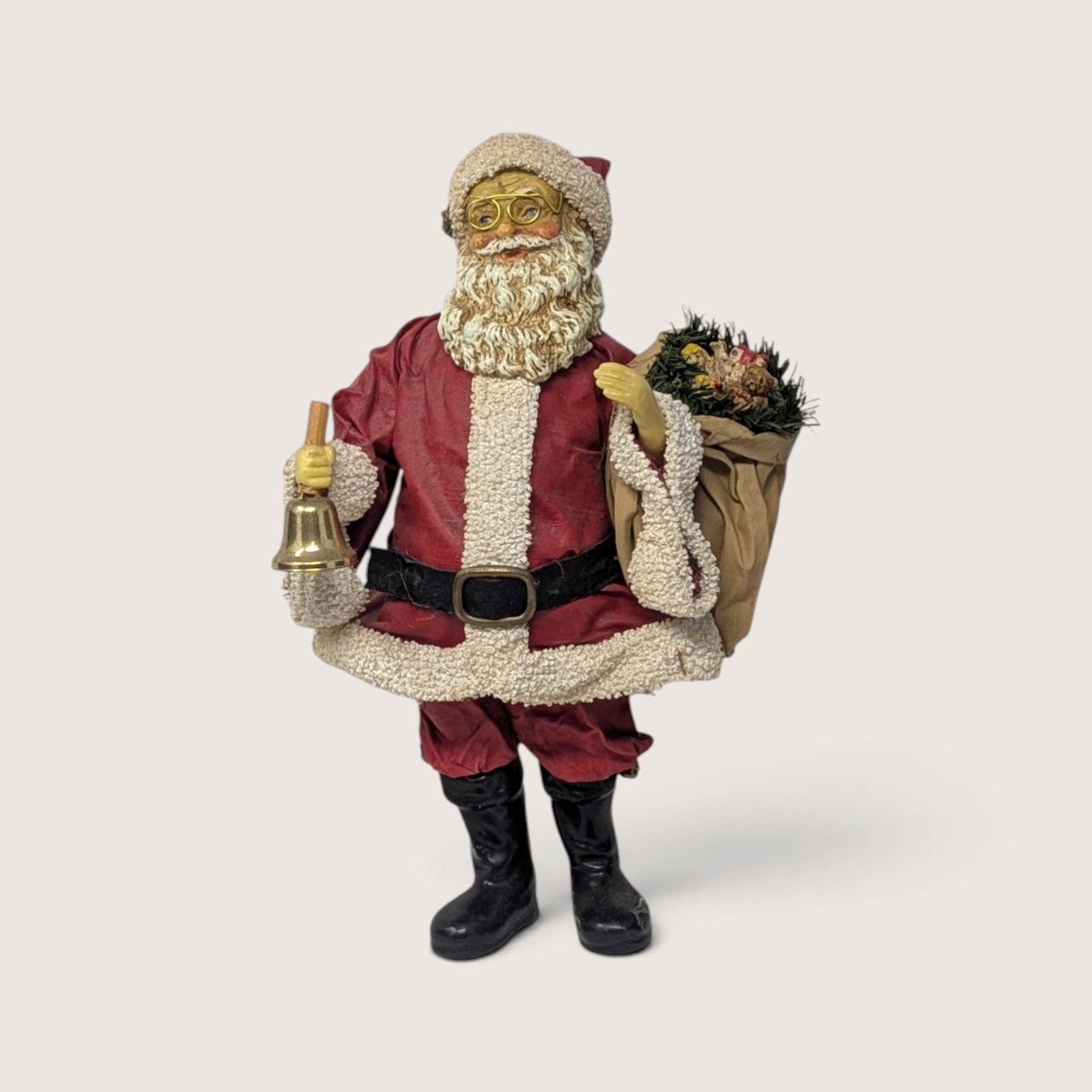 Vintage Midwest Importers fabric mache Santa figurine with bell and toy sack.