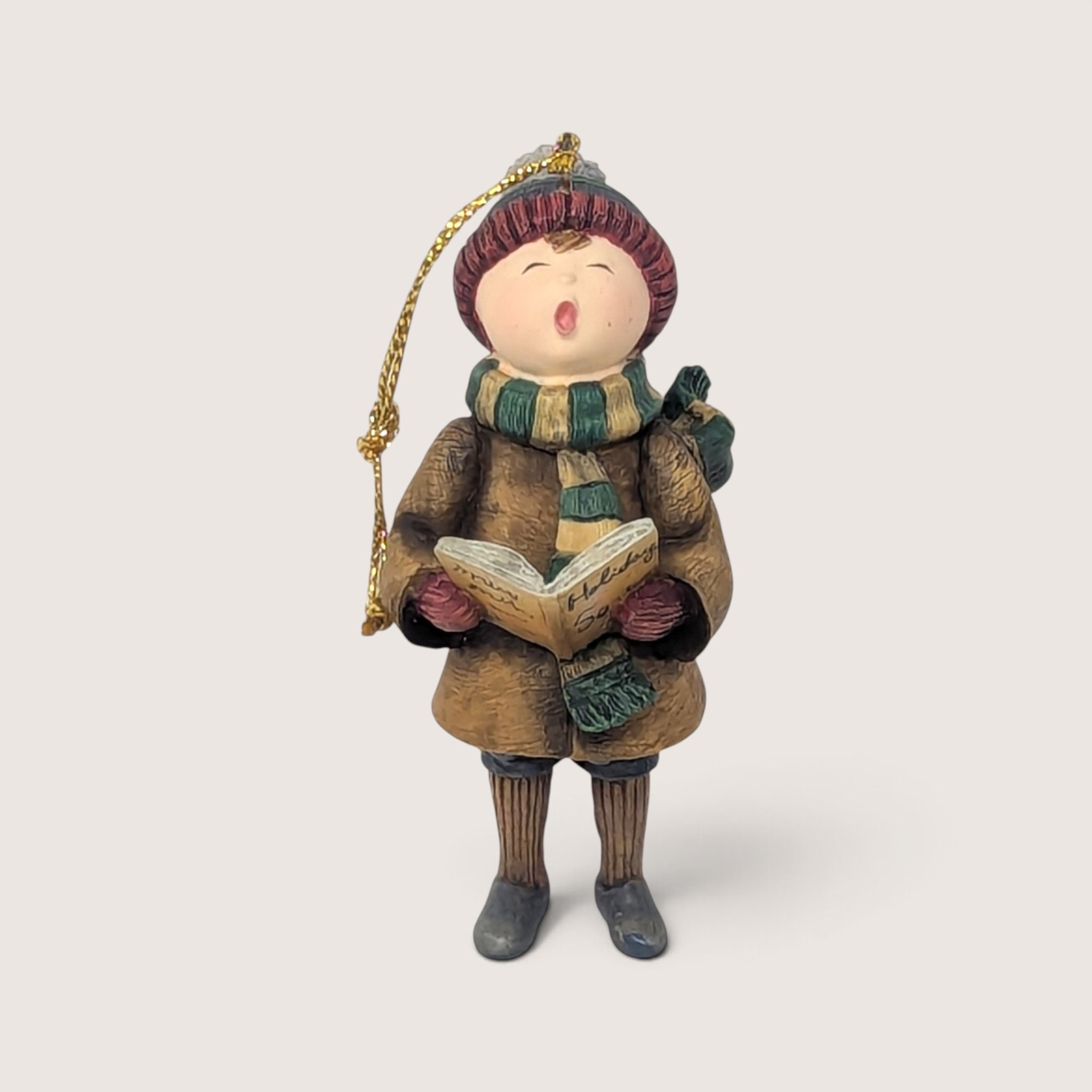 Vintage 1998 Lang and Wise Rejoice resin Christmas tree ornament singing with a book.