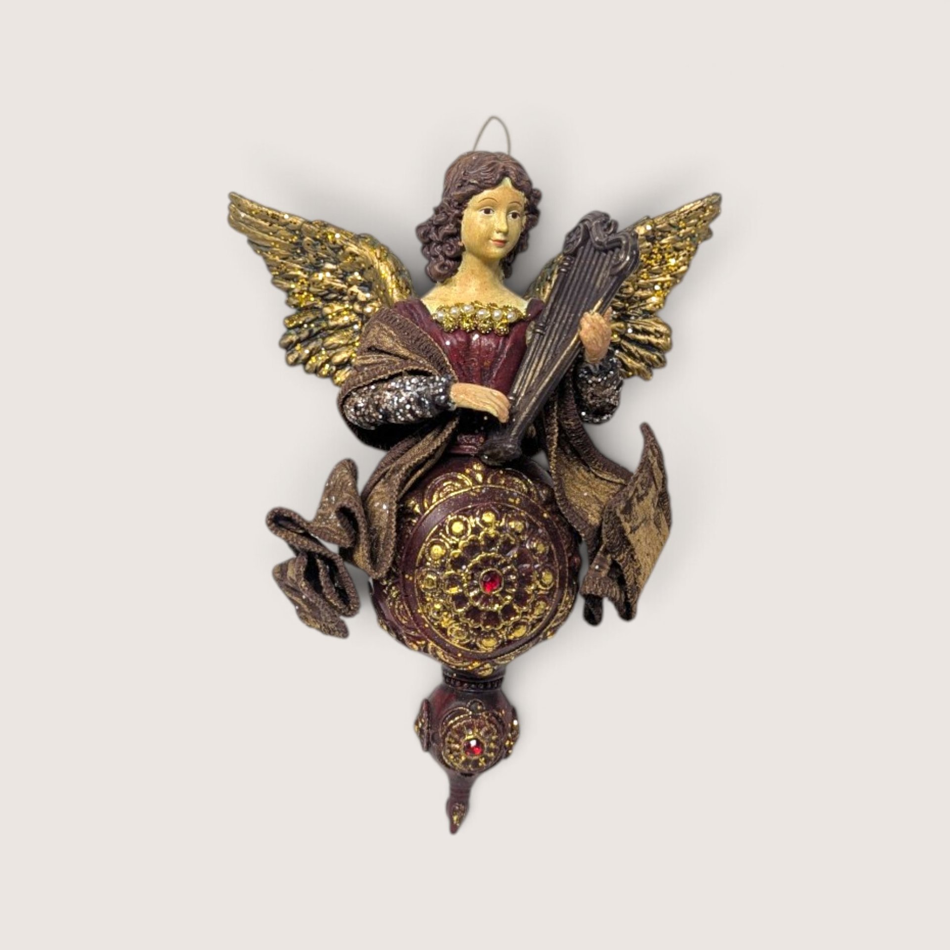 Vintage large fabric mache and plastic angel Christmas tree ornament playing a harp in burgundy and gold.