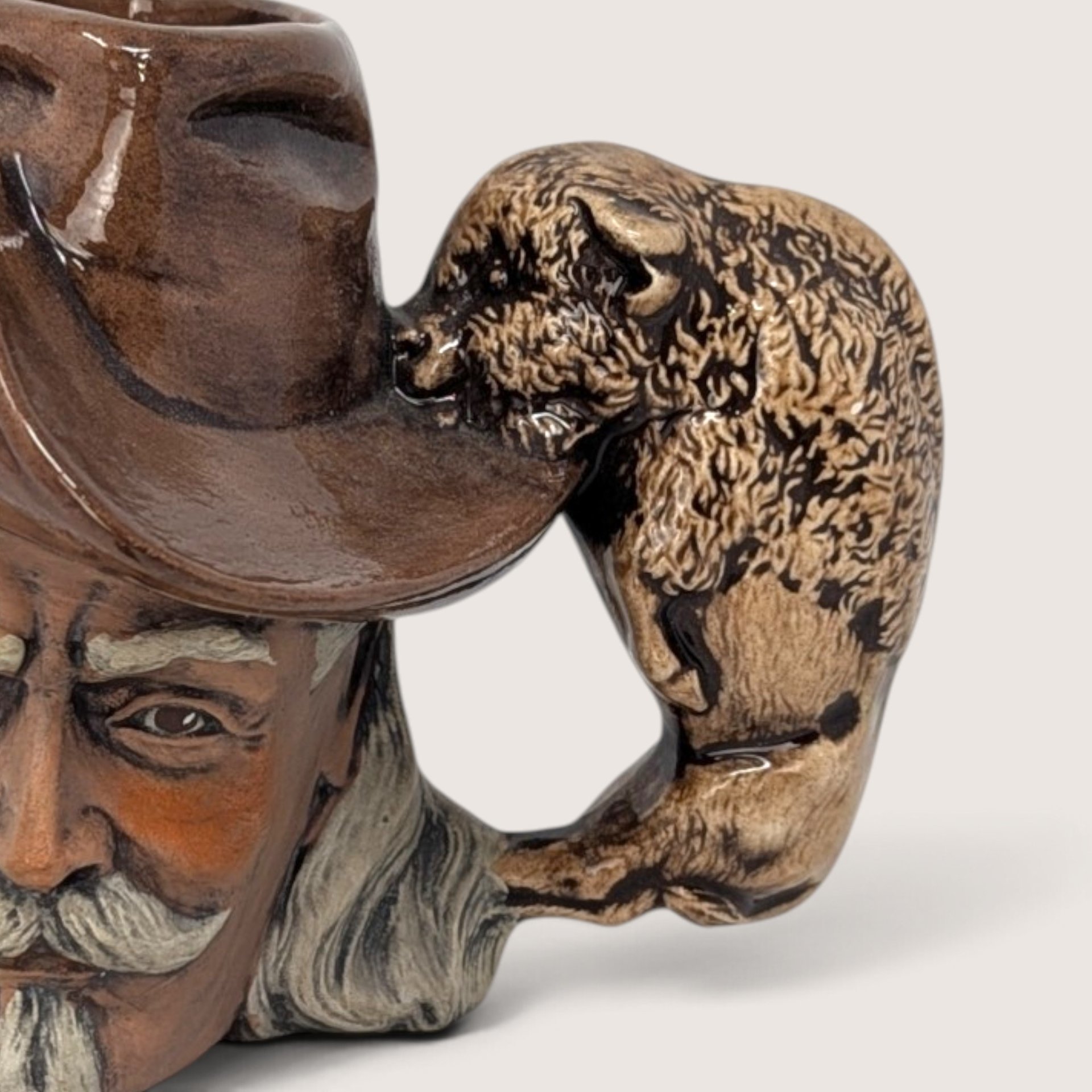 Vintage hand-painted ceramic character mug depicting Buffalo Bill Cody with a sculpted bison handle and "DAD" inscribed on the base.